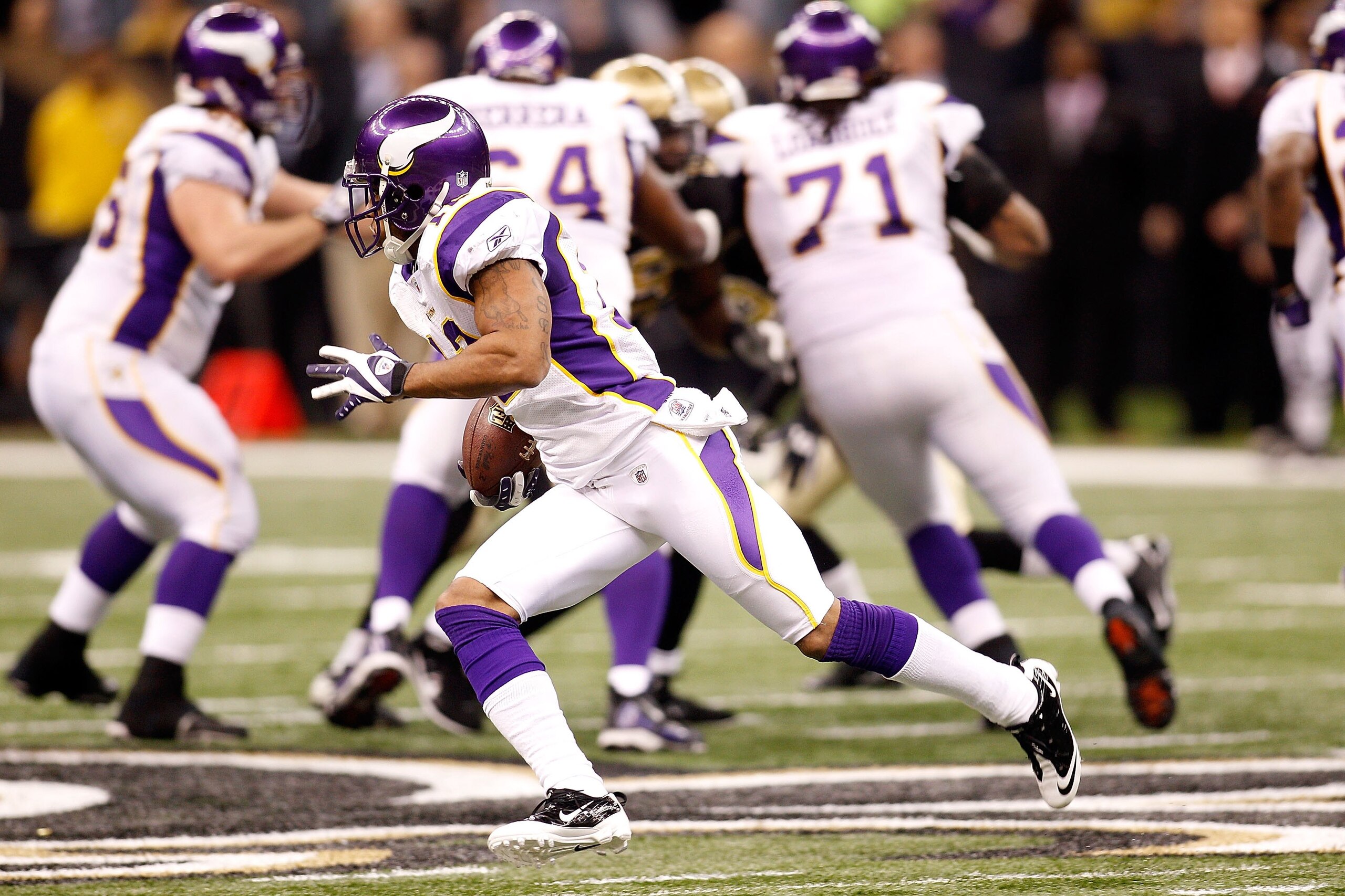 NEW ORLEANS - JANUARY 24:  A generic detail of Percy Harvin #12 of  the Minnesota Vikings returning a punt the New Orleans Saints during the NFC Championship Game at the Louisana Superdome on January 24, 2010 in New Orleans, Louisiana.  (Photo by Chris Gr