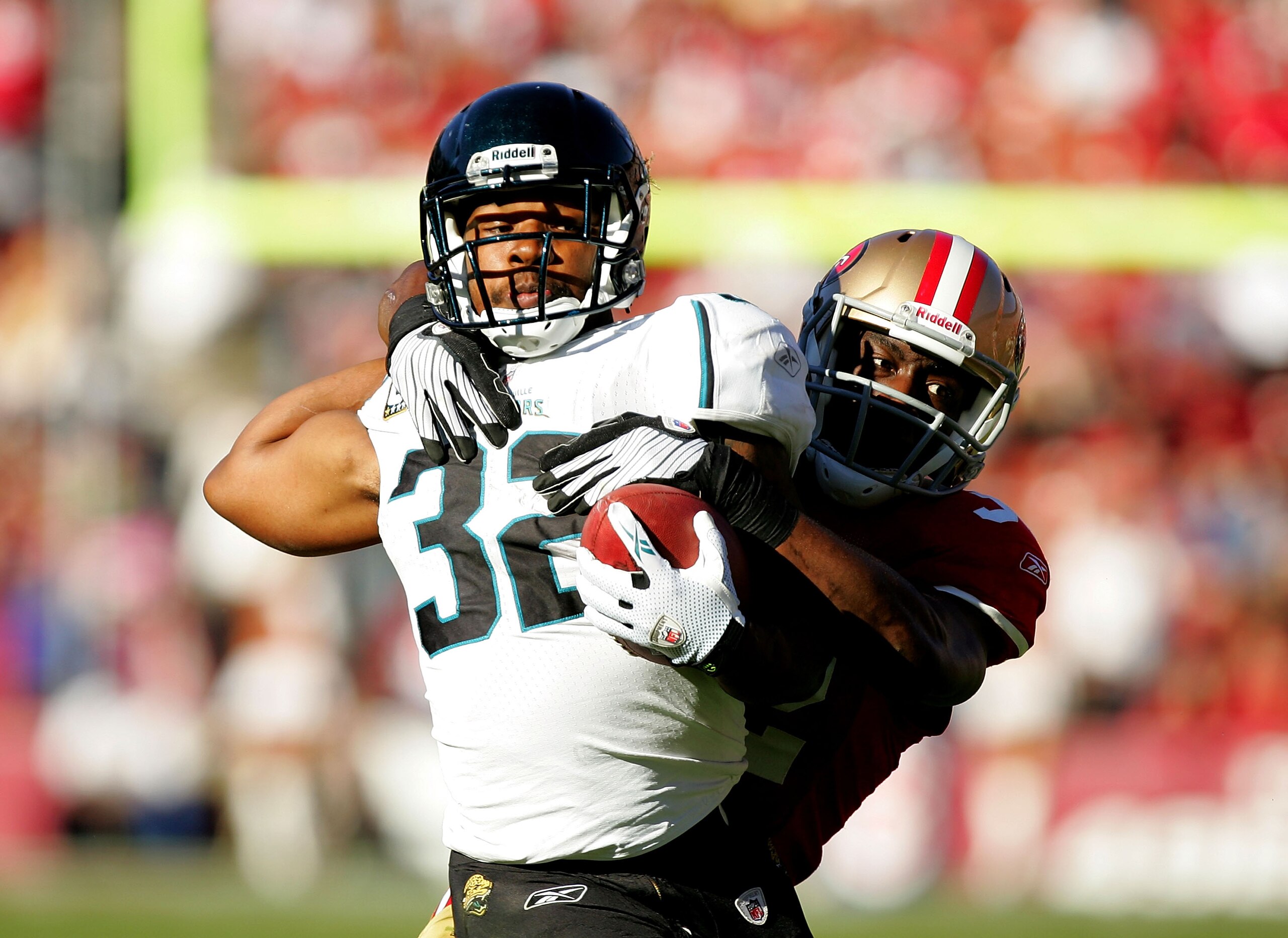 SAN FRANCISCO - NOVEMBER 29:  Maurice Jones-Drew #32 of the Jacksonville Jaguars is tackled by Michael Lewis #32 of the San Francisco 49ers at Candlestick Park on November 29, 2009 in San Francisco, California.  (Photo by Ezra Shaw/Getty Images)
