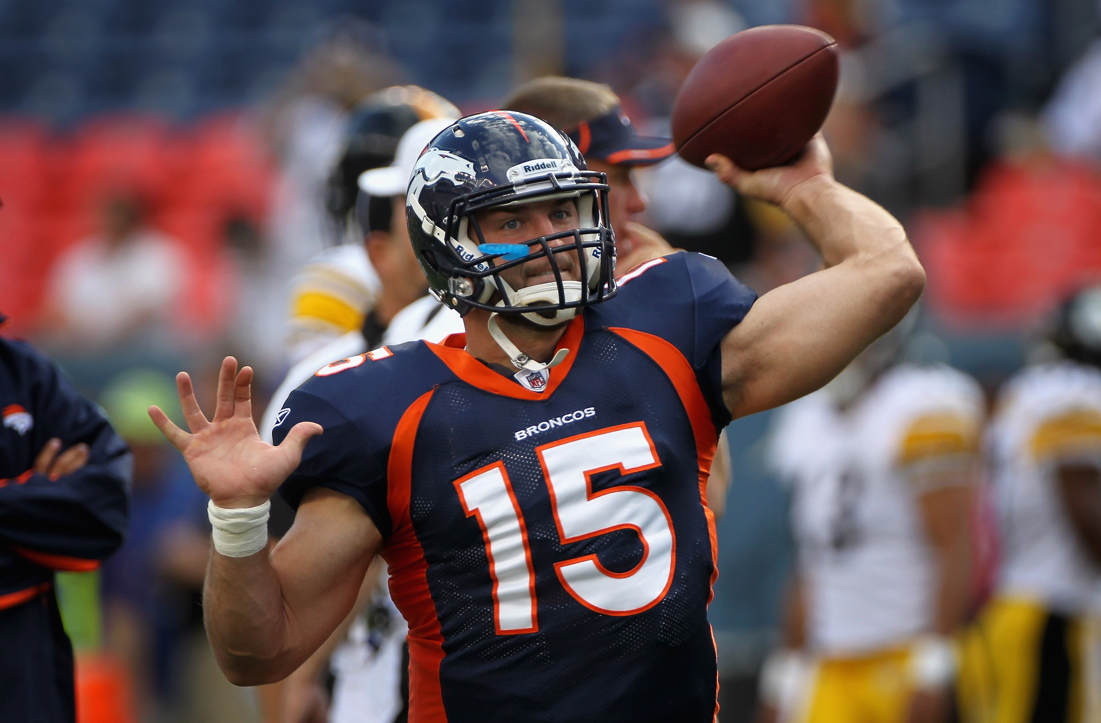 DENVER - AUGUST 29:  Quarterback Tim Tebow #15 of the Denver Broncos warms up prior to facing the Pittsburgh Steelers during preseason NFL action at INVESCO Field at Mile High on August 29, 2010 in Denver, Colorado.  (Photo by Doug Pensinger/Getty Images)