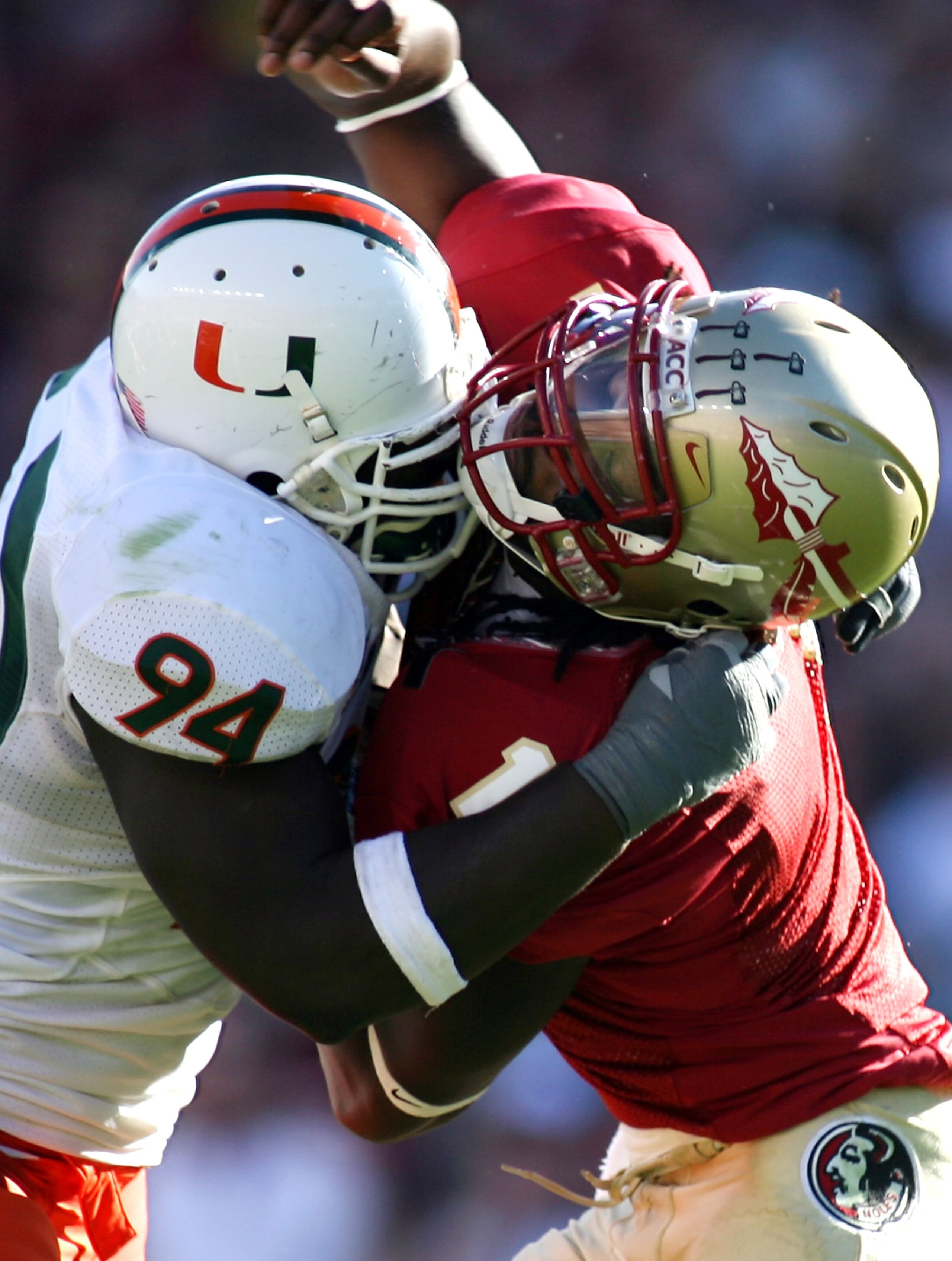 TALLAHASSEE, FL - OCTOBER 20: Quarterback Xavier Lee #1 of the Florida State Seminoles is hit by defensive end Eric Moncur #94 from the University of Miami Hurricanes at Bobby Bowden Field at Doak Campbell Stadium October 20, 2007 in Tallahassee, Florida TALLAHASSEE, FL - OCTOBER 20: Quarterback Xavier Lee #1 of the Florida State Seminoles is hit by defensive end Eric Moncur #94 from the University of Miami Hurricanes at Bobby Bowden Field at Doak Campbell Stadium October 20, 2007 in Tallahassee, Florida