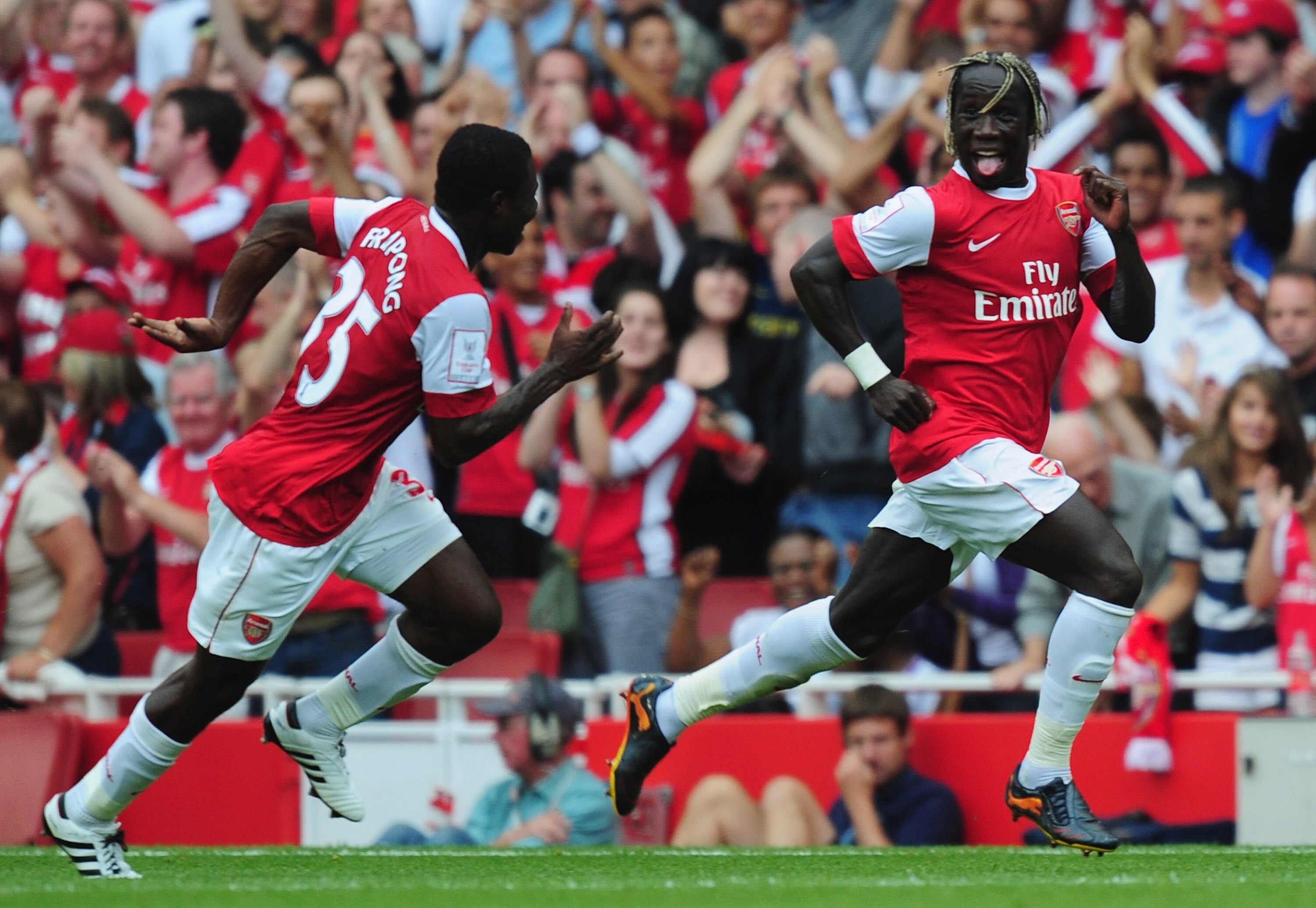 LONDON, ENGLAND - AUGUST 01:   Bacary Sagna of Arsenal celebrates after scoring with team mate Emmanuel Frimpong during the Emirates Cup match between Arsenal and Celtic at Emirates Stadium on August 1, 2010 in London, England.  (Photo by Mike Hewitt/Gett
