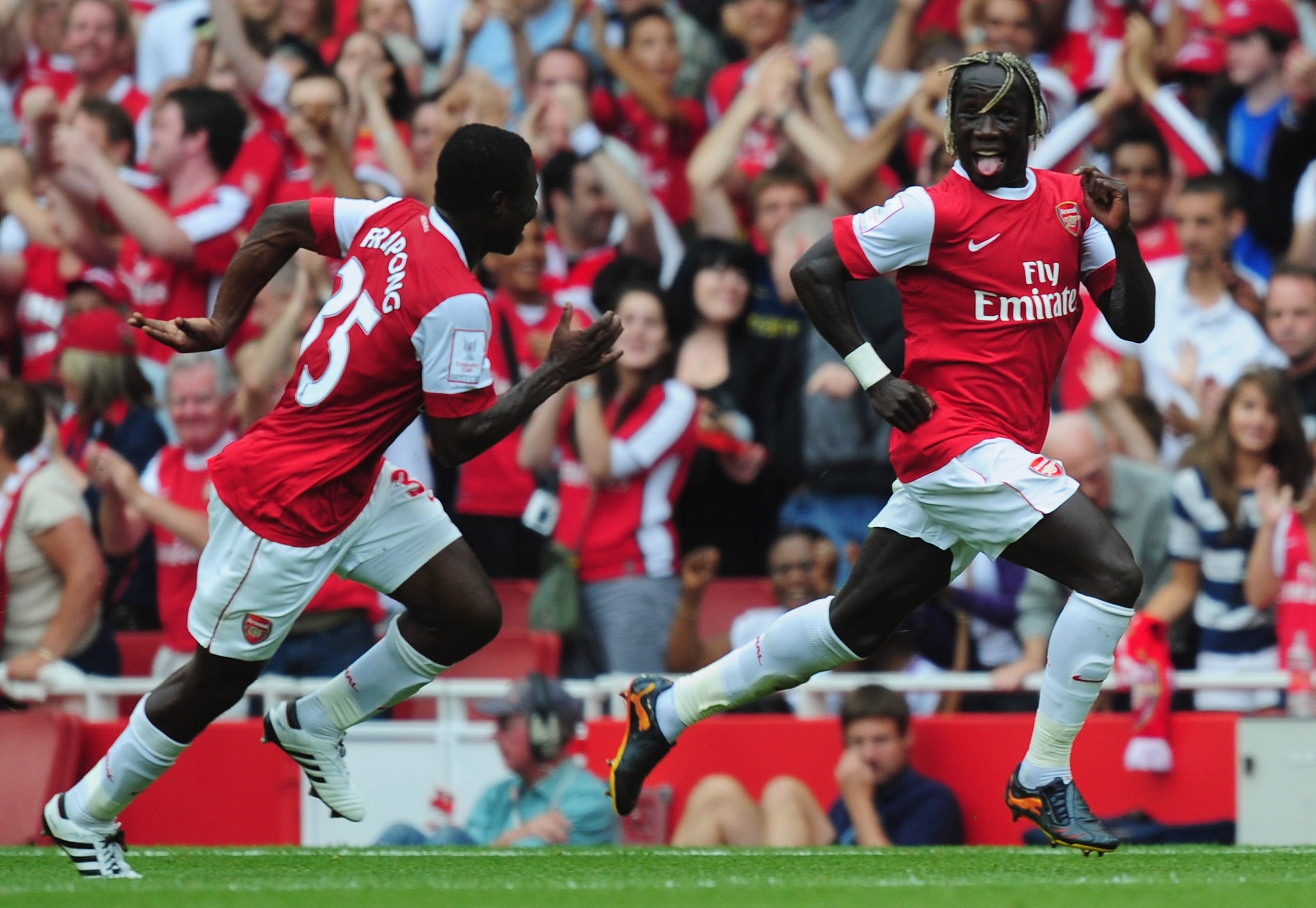 LONDON, ENGLAND - AUGUST 01:   Bacary Sagna of Arsenal celebrates after scoring with team mate Emmanuel Frimpong during the Emirates Cup match between Arsenal and Celtic at Emirates Stadium on August 1, 2010 in London, England.  (Photo by Mike Hewitt/Gett