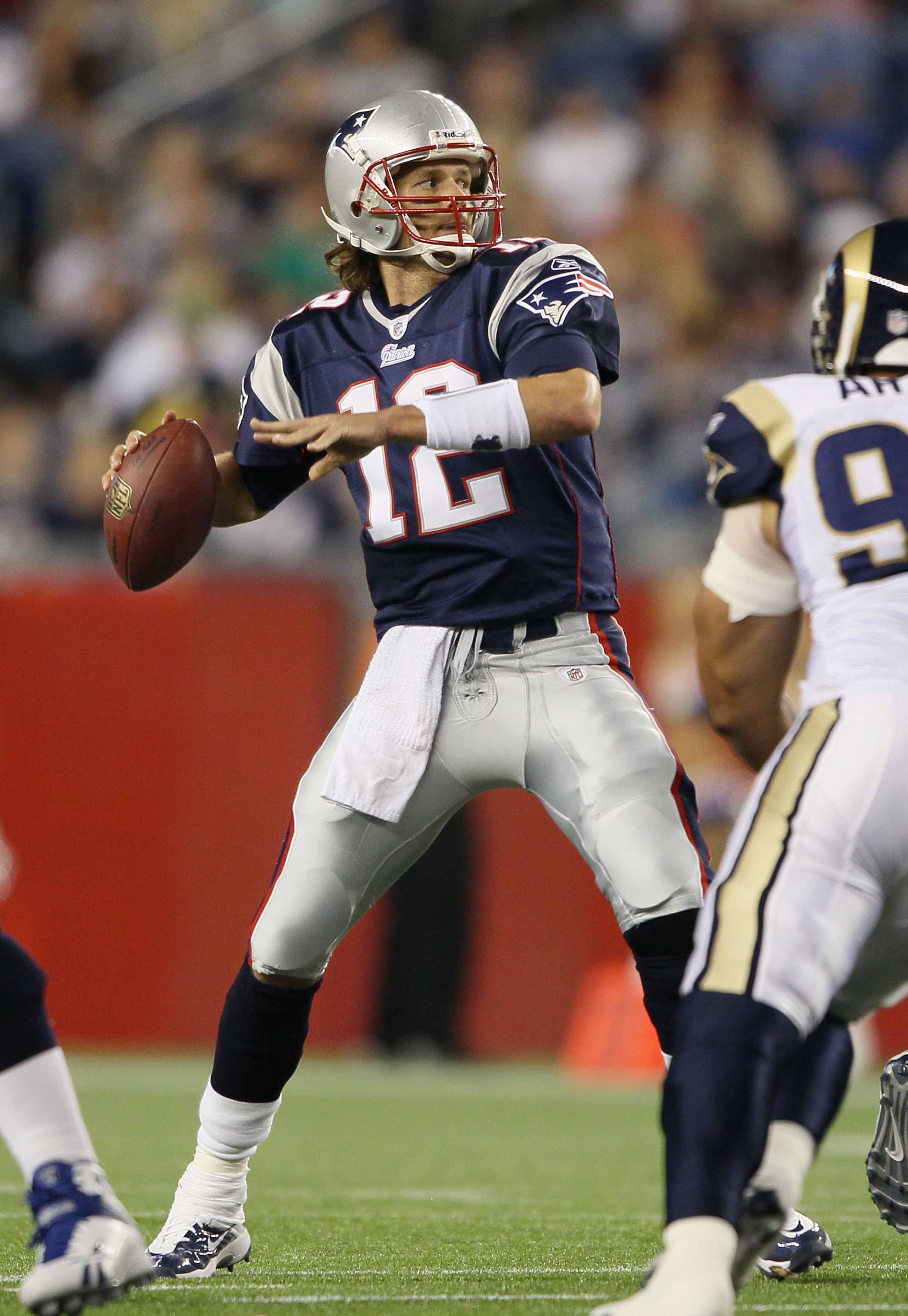 FOXBORO, MA - AUGUST 26:  Tom Brady #12 of the New England Patriots looks to pass in the second half against the St. Louis Rams on August 26, 2010 at Gillette Stadium in Foxboro, Massachusetts. The Rams defeated the Patriots 36-35.  (Photo by Elsa/Getty I