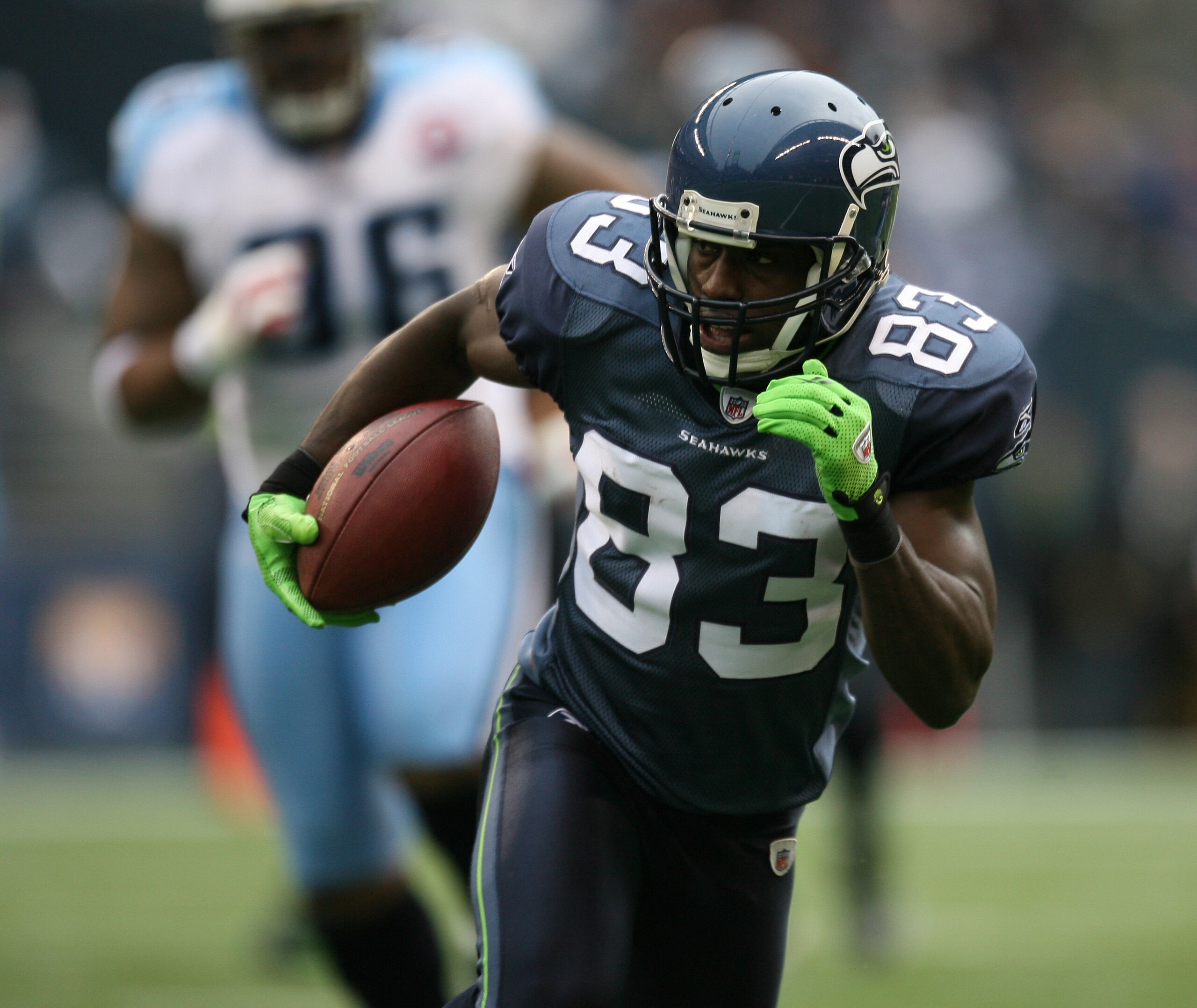 SEATTLE - JANUARY 03:  Wide receiver Deion Branch #83 of the Seattle Seahawks rushes against the Tennessee Titans on January 3, 2010 at Qwest Field in Seattle, Washington. The Titans defeated the Seahawks 17-13. (Photo by Otto Greule Jr/Getty Images)