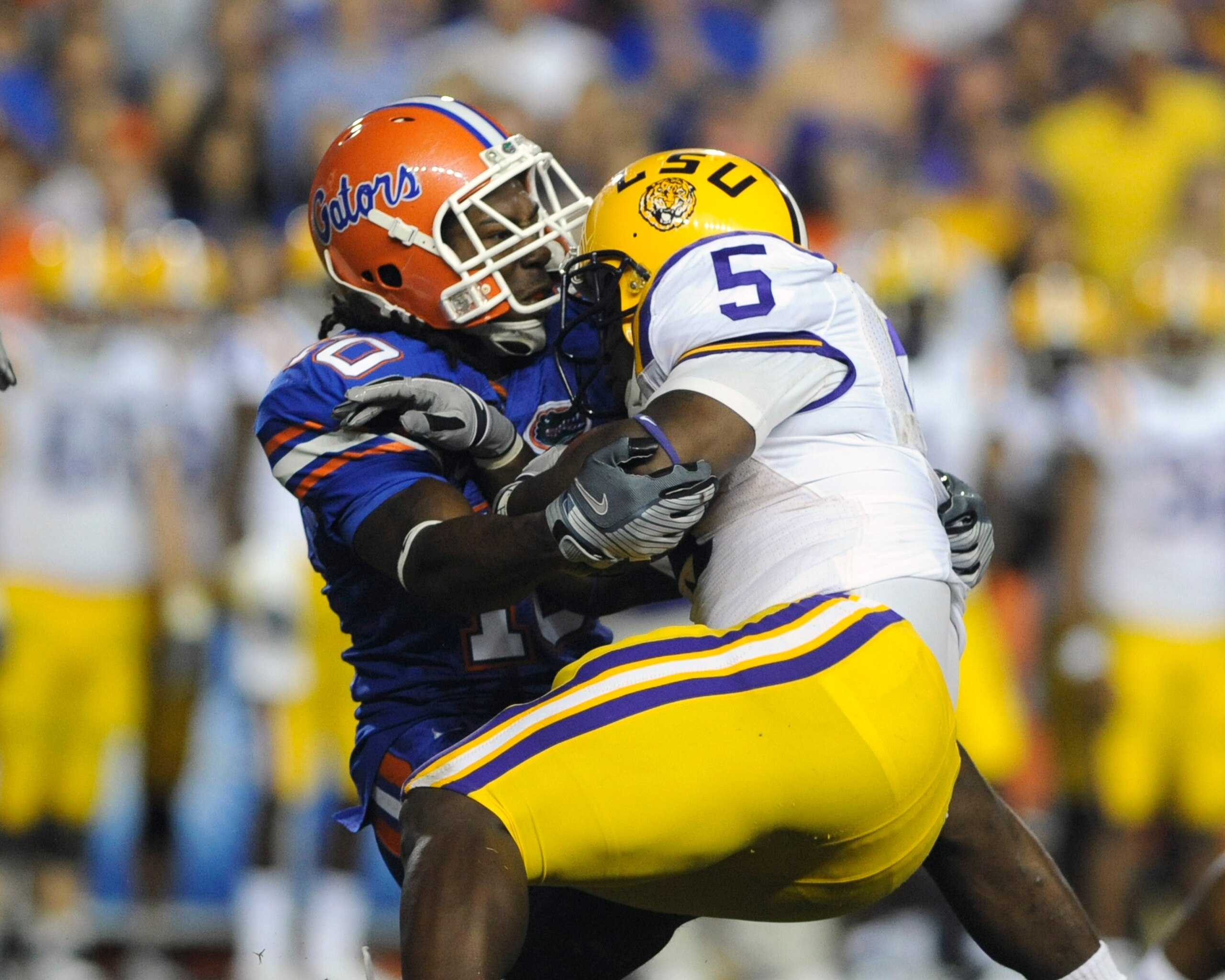 GAINESVILLE, FL - OCTOBER 11: Safety Will Hill #10 of the University of Florida Gators tackles running back Keiland Williams #5 of the LSU Tigers at Ben Hill Griffin Stadium on October 11, 2008 in Gainesville, Florida.  (Photo by Al Messerschmidt/Getty Im