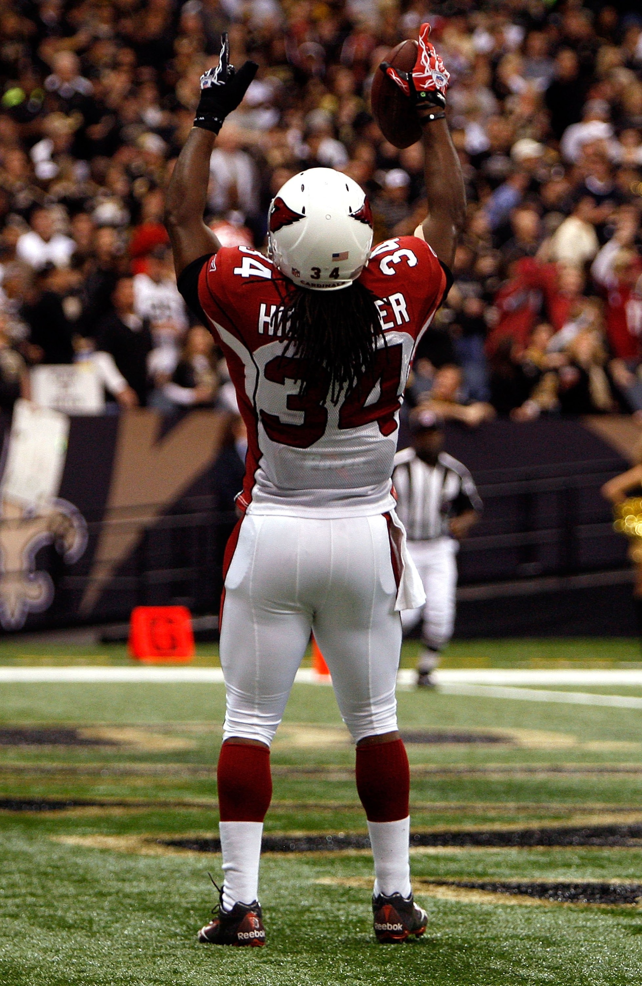 NEW ORLEANS - JANUARY 16: Tim Hightower #34 of the Arizona Cardinals celebrates after he scored a 70-yard rushing touchdown in the first quarter against the New Orleans Saints during the NFC Divisional Playoff Game at Louisana Superdome on January 16, 20 NEW ORLEANS - JANUARY 16: Tim Hightower #34 of the Arizona Cardinals celebrates after he scored a 70-yard rushing touchdown in the first quarter against the New Orleans Saints during the NFC Divisional Playoff Game at Louisana Superdome on January 16, 20