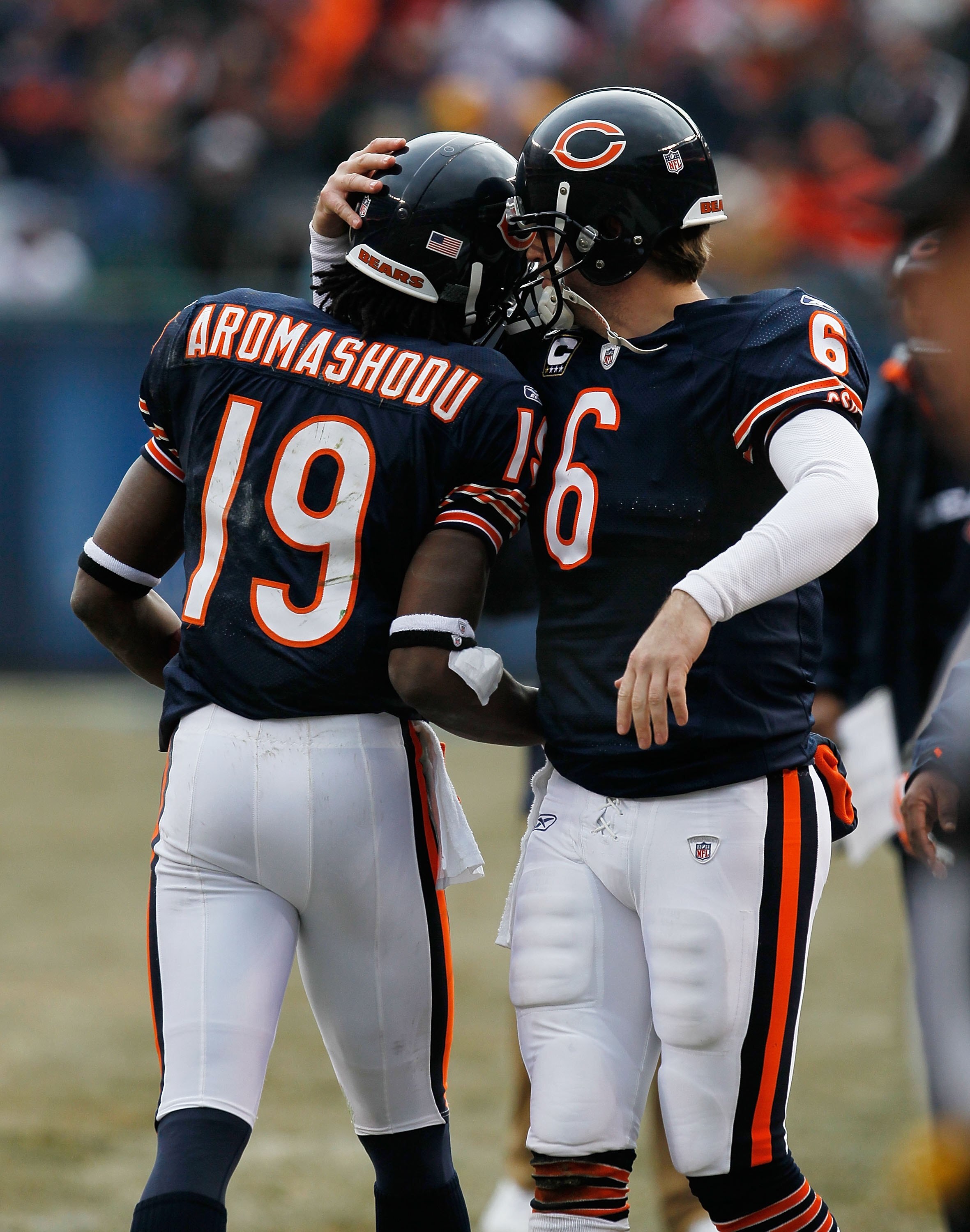 CHICAGO - DECEMBER 13: Jay Cutler #6 of the Chicago Bears congratulates teammate Devin Aromashodu #19 after a touchdown against the Green Bay Packers at Soldier Field on December 13, 2009 in Chicago, Illinois. The Packers defeated the Bears 21-14. (Photo 