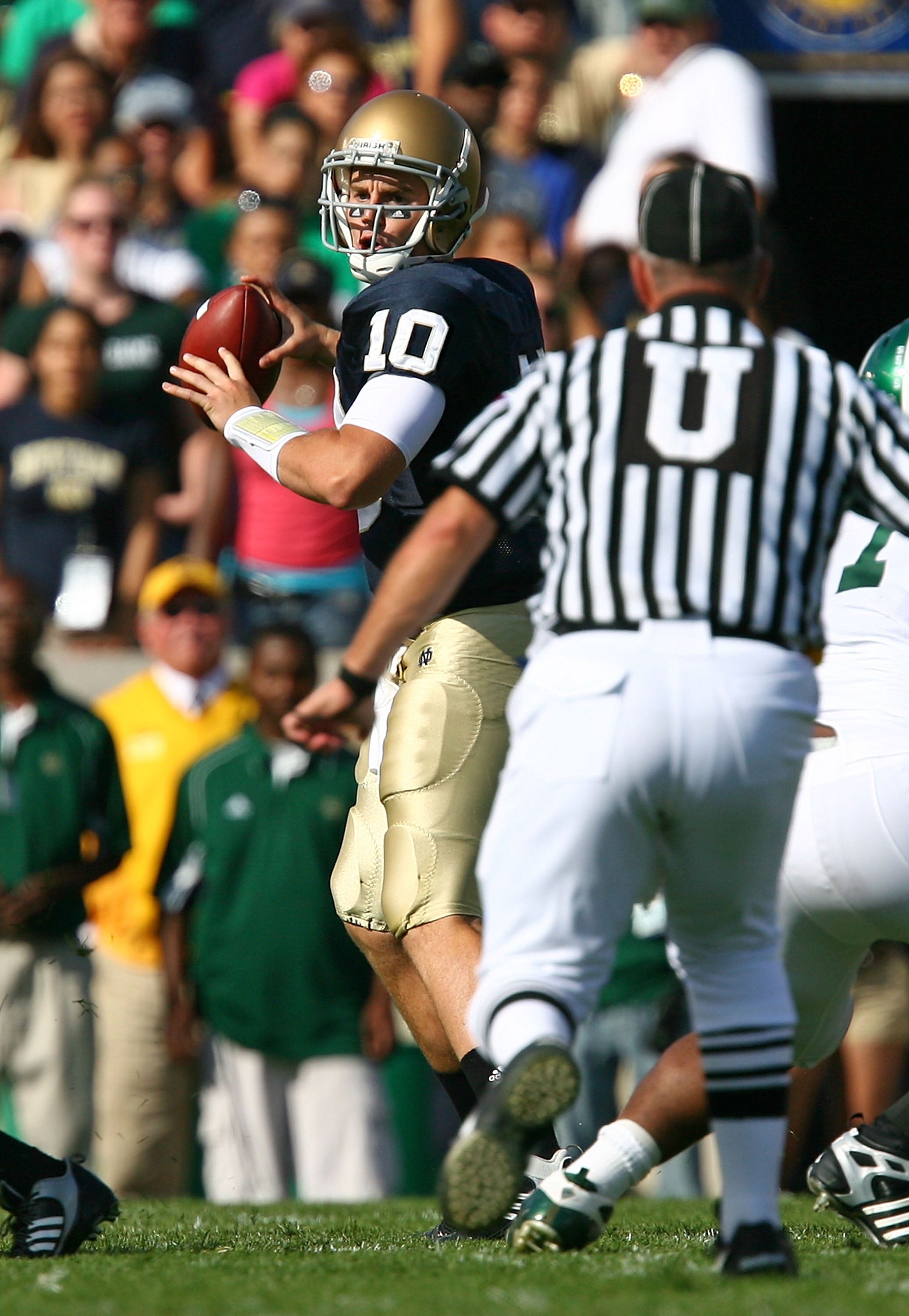 SOUTH BEND, IN - SEPTEMBER 19: Dayne Crist #10 of the Notre Dame Fighting Irish looks for a receiver against the Michigan State Spartans on September 19, 2009 at Notre Dame Stadium in South Bend, Indiana. Notre Dame defeated Michigan State 33-30. (Photo b