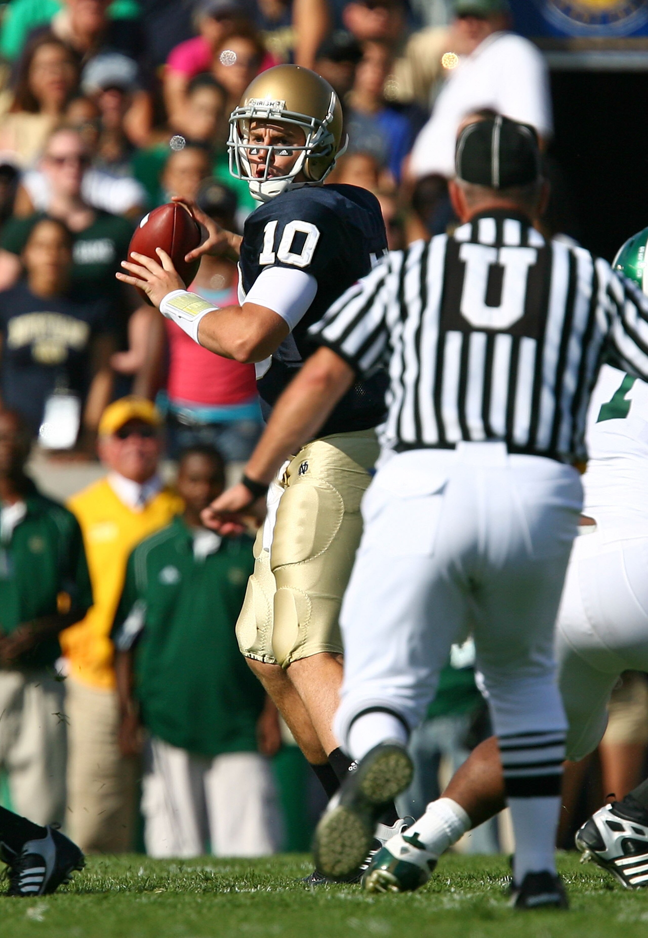 SOUTH BEND, IN - SEPTEMBER 19: Dayne Crist #10 of the Notre Dame Fighting Irish looks for a receiver against the Michigan State Spartans on September 19, 2009 at Notre Dame Stadium in South Bend, Indiana. Notre Dame defeated Michigan State 33-30. (Photo b