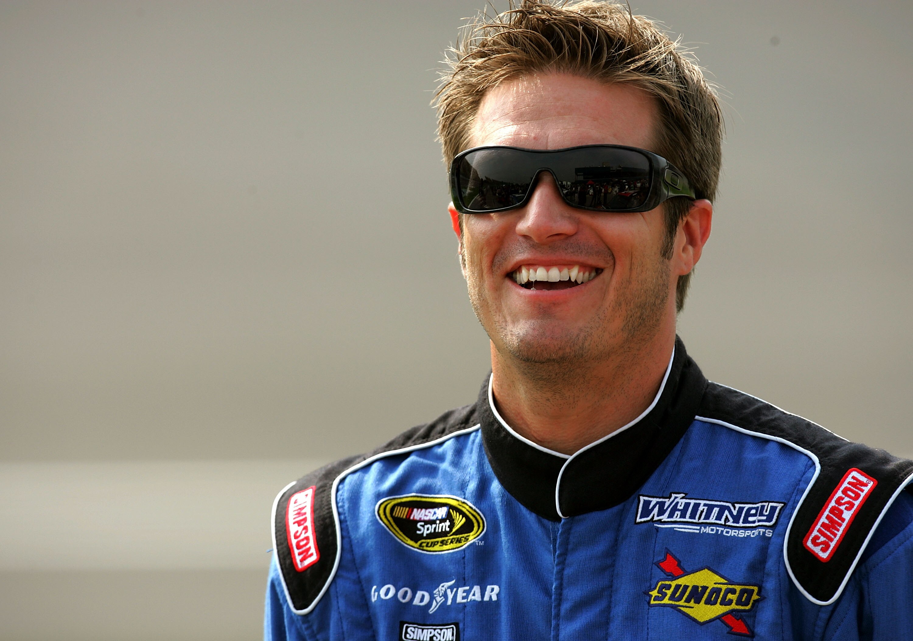 BROOKLYN, MI - JUNE 11: J.J. Yeley, driver of the #46 Promise Village Dodge, smiles during qualifying for the NASCAR Sprint Cup Series Heluva Good! Sour Cream Dips 400 at Michigan International Speedway on June 11, 2010 in Brooklyn, Michigan.  (Photo by J