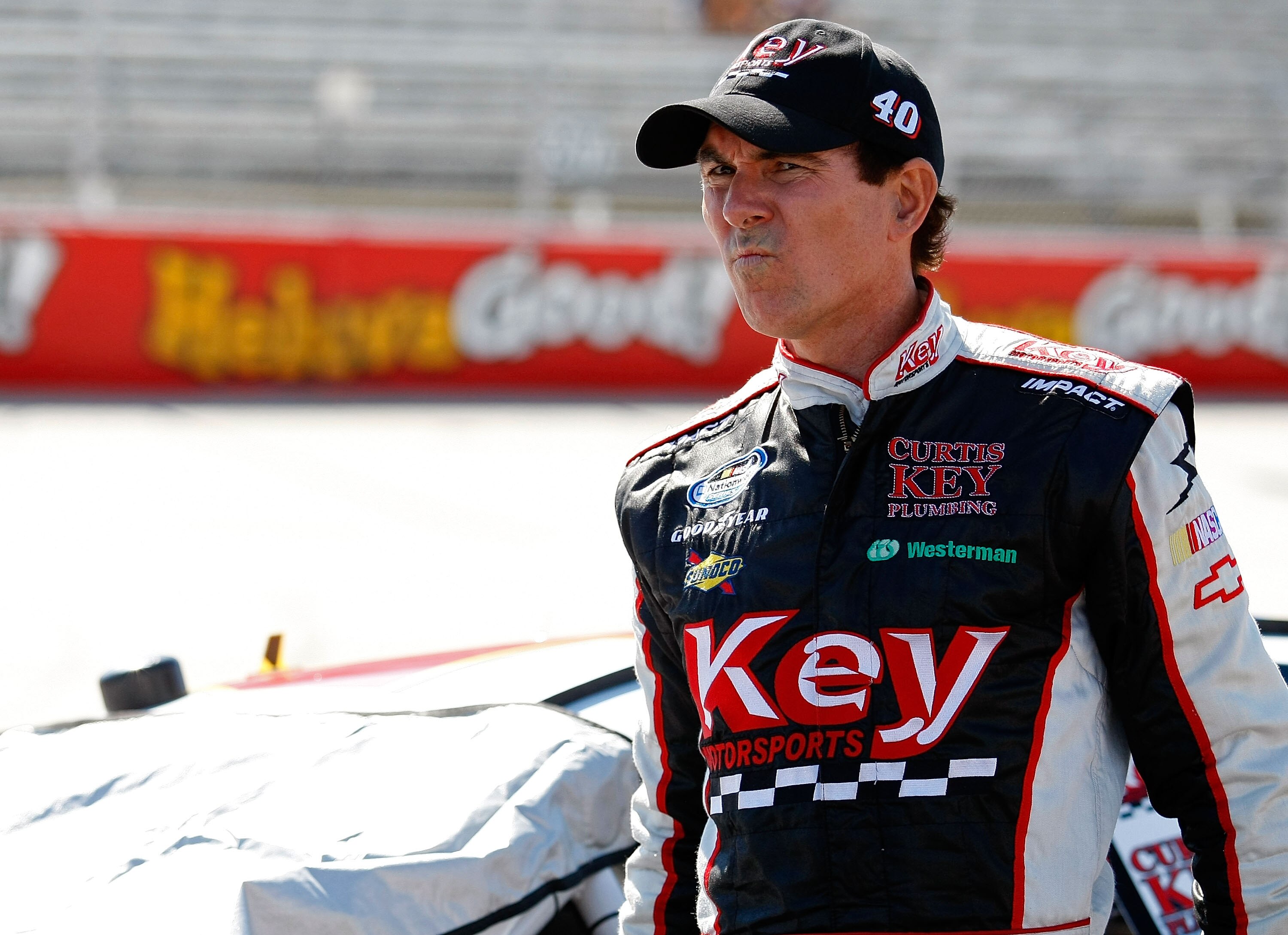 DOVER, DE - MAY 15:  Mike Bliss, driver of the #40 Key Motorsports Chevrolet, walks on the grid during qualifying for the NASCAR Nationwide Series Heluva Good 200 at Dover International Speedway on May 15, 2010 in Dover, Delaware.  (Photo by Geoff Burke/G