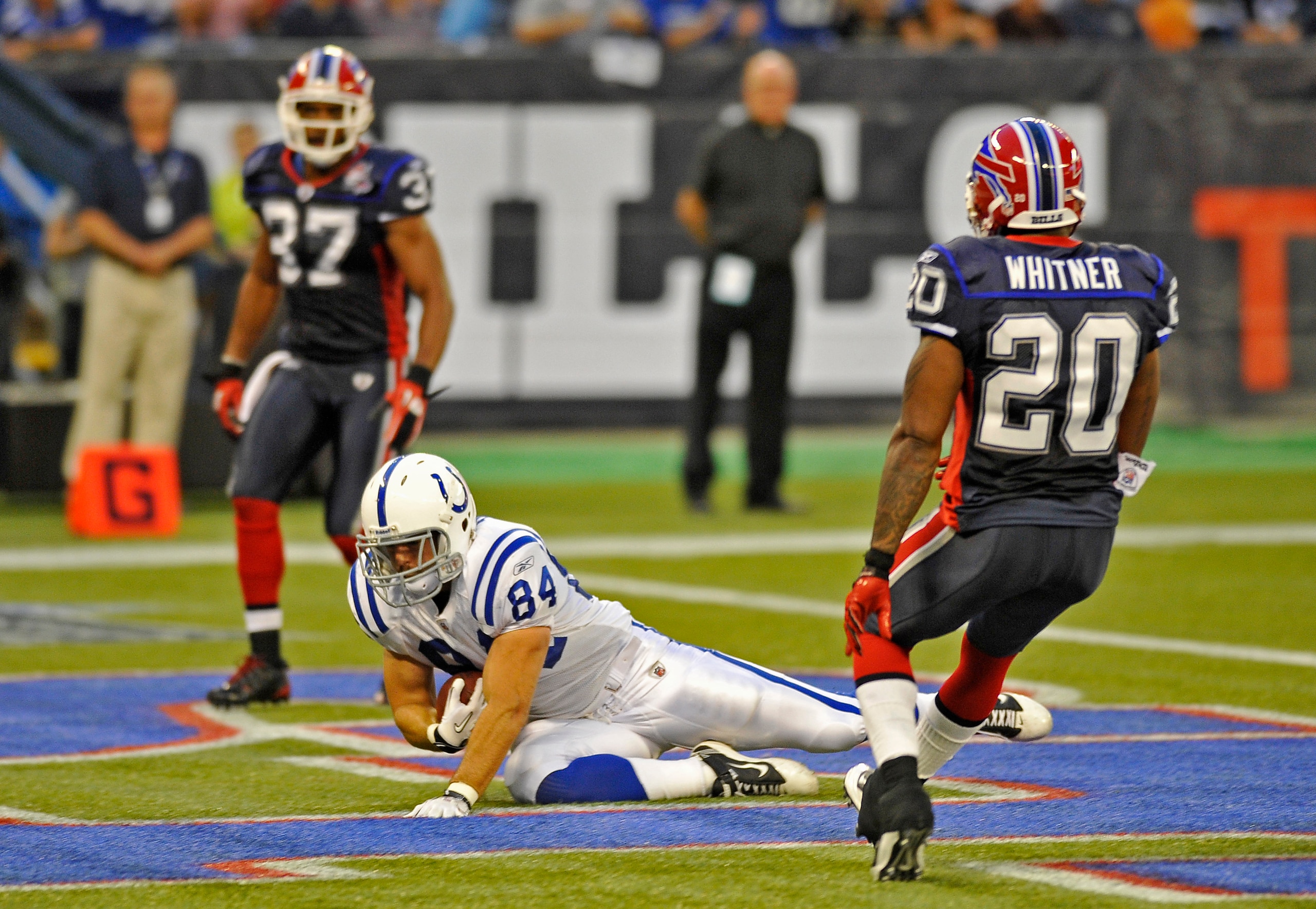 TORONTO - AUGUST 19:  Jacob Tamme #84 the Indianapolis Colts scores a first half touch down with George Wilson #37 and Donte Whitner #20 of the buffalo Bills defending during game action August 19, 2010 at the Rogers Centre in Toronto, Ontario, Canada. (P