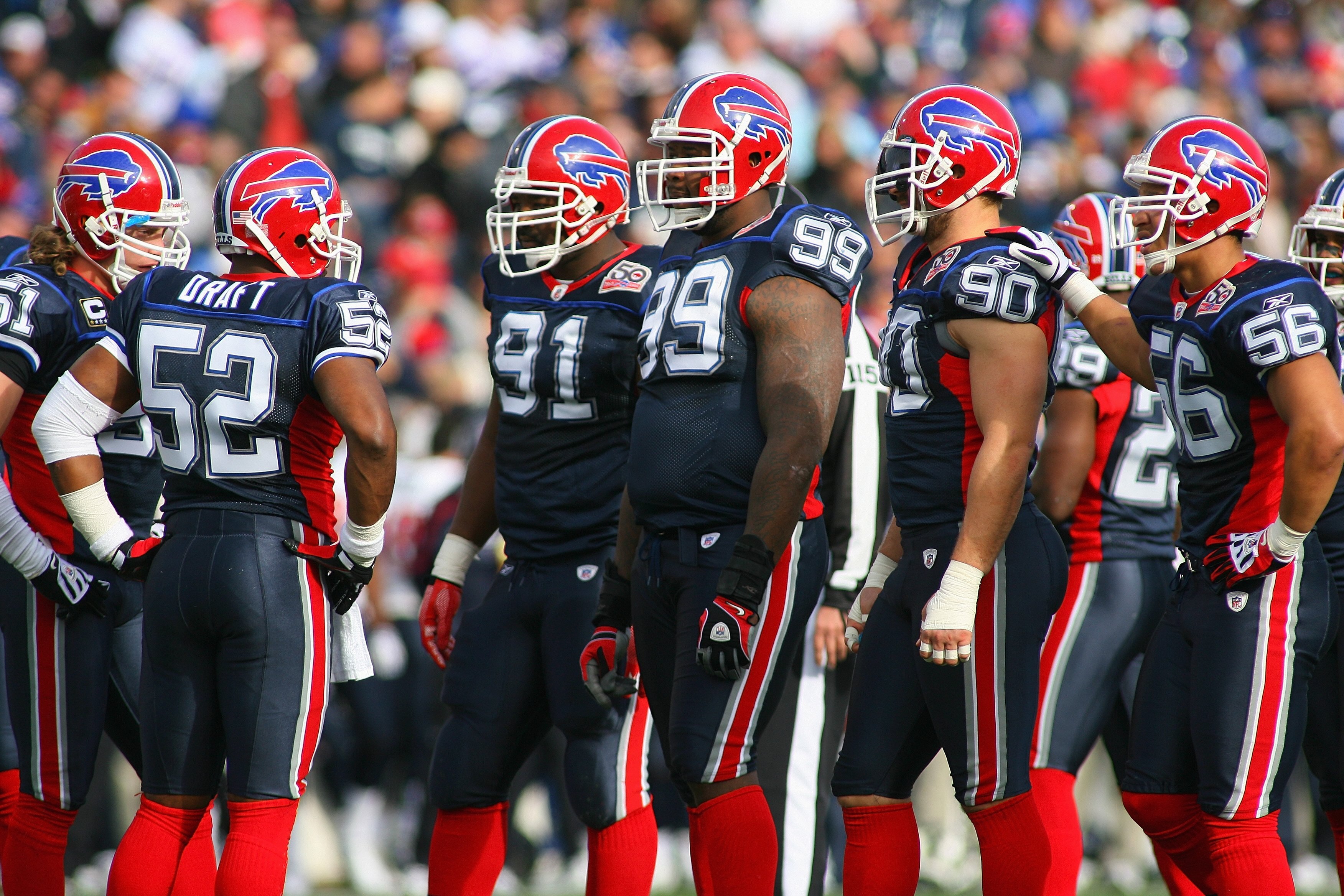 ORCHARD PARK, NY - NOVEMBER 01:  Marcus Stroud #99 of the Buffalo Bills stands on the field with teammates during the game against the Houston Texans at Ralph Wilson Stadium on November 1, 2009 in Orchard Park, New York. Houston won 31-10. (Photo by Rick