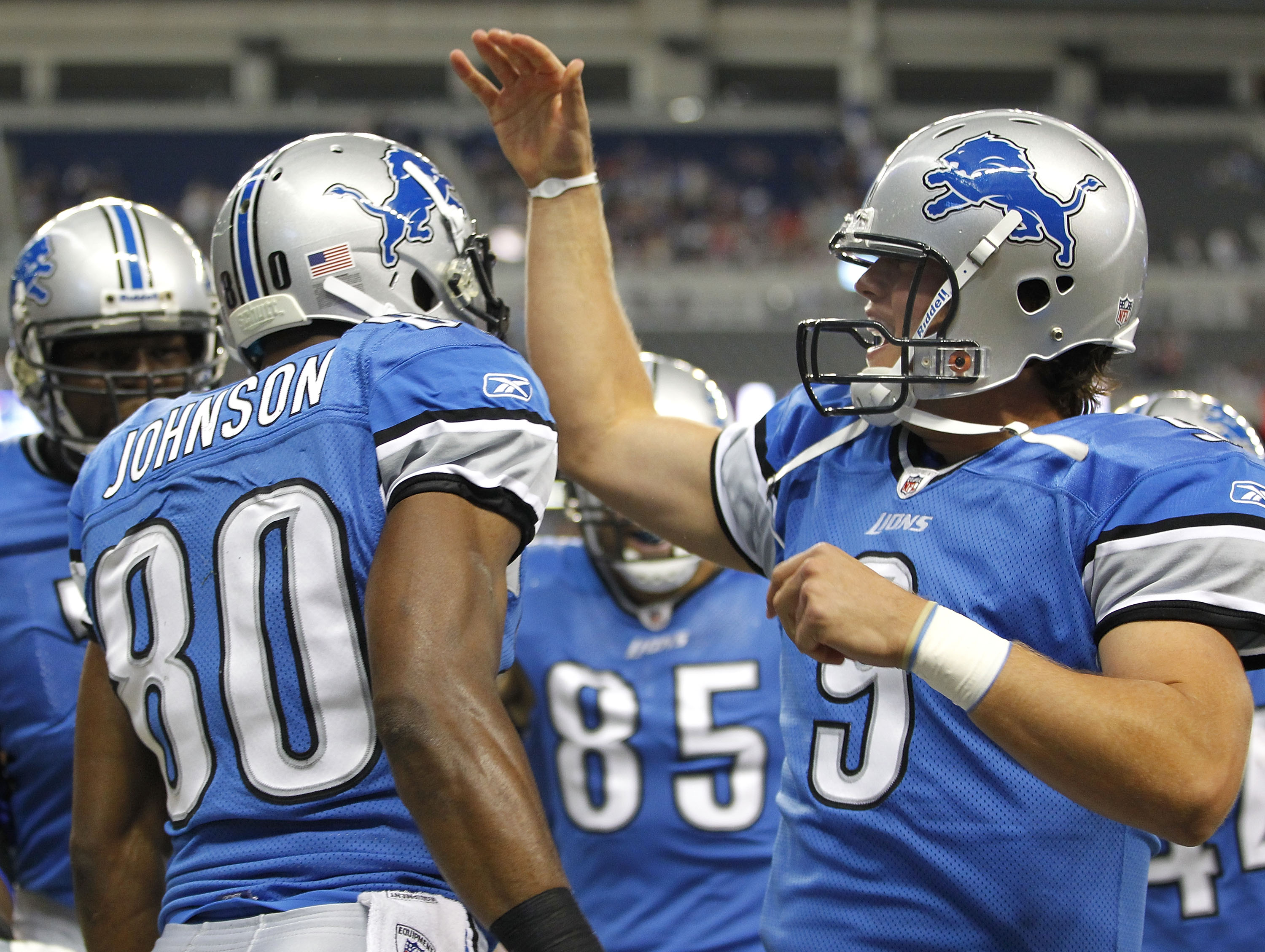 DETROIT - AUGUST 28:  Bryant Johnson #80 of the Detroit Lions celebrates a first quarter touchdown with Matthew Stafford #9 of the Cleveland Browns during a preseason game on August 28, 2010 at Ford Field in Detroit, Michigan.  (Photo by Gregory Shamus/Ge