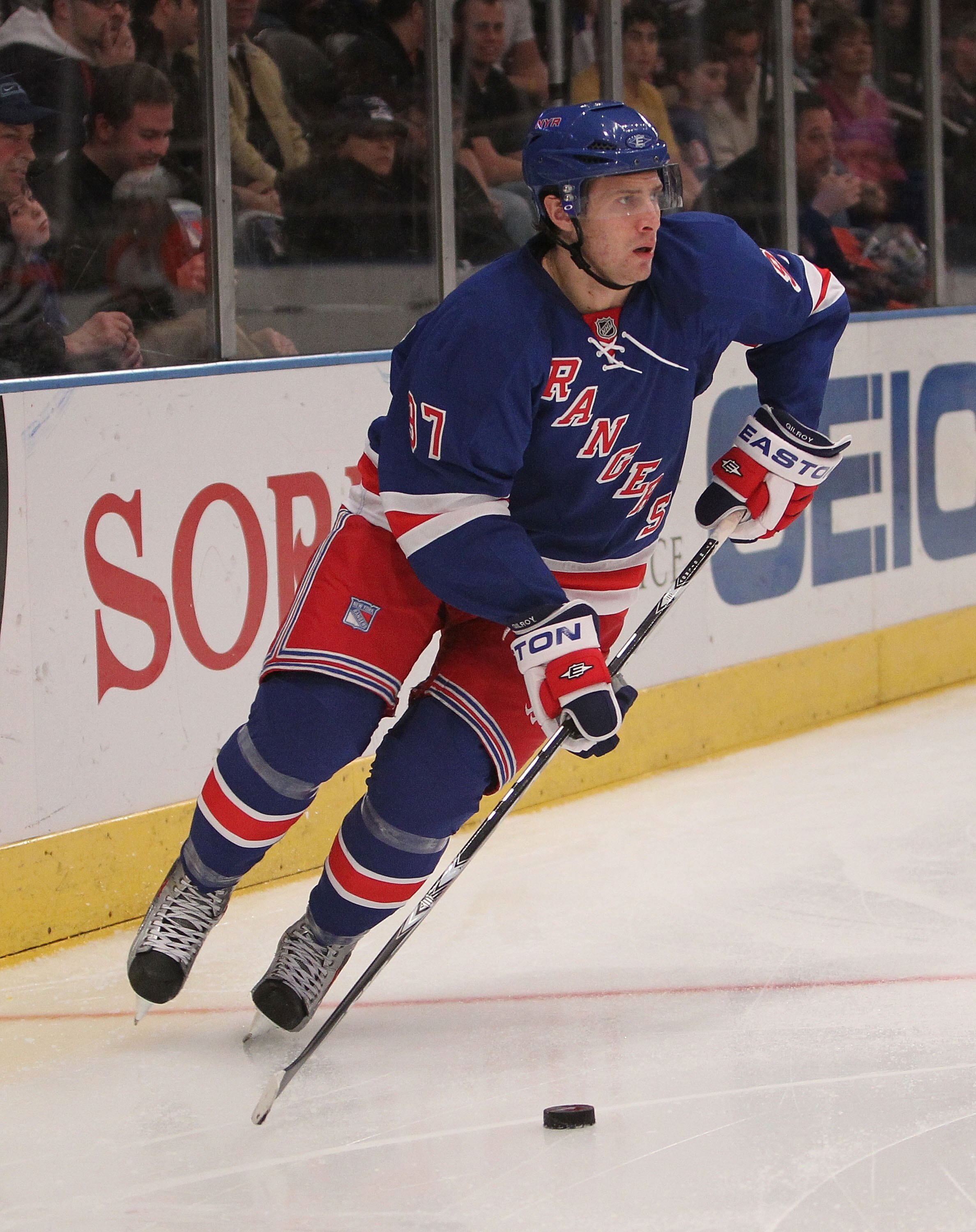 NEW YORK - MARCH 14:  Matt Gilroy #97 of the New York Rangers skates with the puck against the Philadelphia Flyers at Madison Square Garden on March 14, 2010 in New York City.  (Photo by Nick Laham/Getty Images)