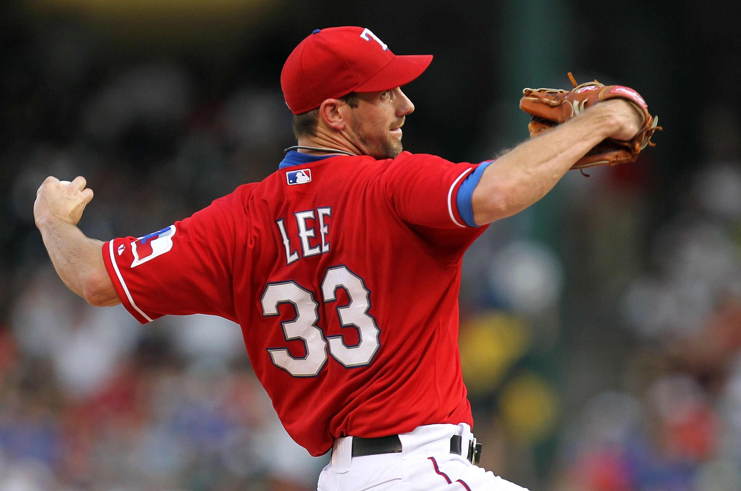 ARLINGTON, TX - JULY 22:  Pitcher Cliff Lee #33 of the Texas Rangers throws against the Los Angeles Angels of Anaheim on July 22, 2010 at Rangers Ballpark in Arlington, Texas.  (Photo by Ronald Martinez/Getty Images)