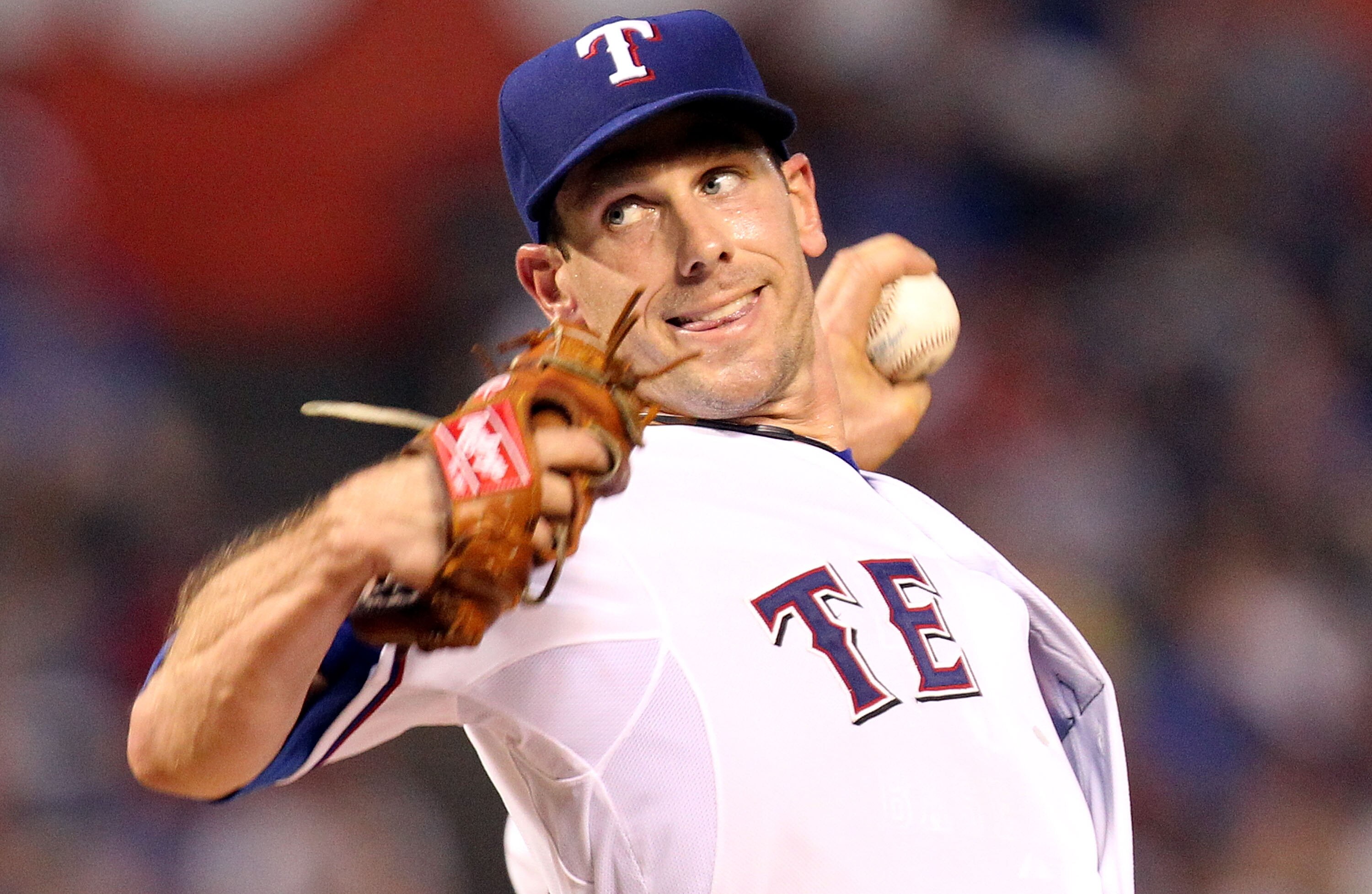ARLINGTON, TX - JULY 10:  Pitcher Cliff Lee #33 of the Texas Rangers throws against the Baltimore Orioles on July 10, 2010 at Rangers Ballpark in Arlington, Texas.  (Photo by Ronald Martinez/Getty Images)