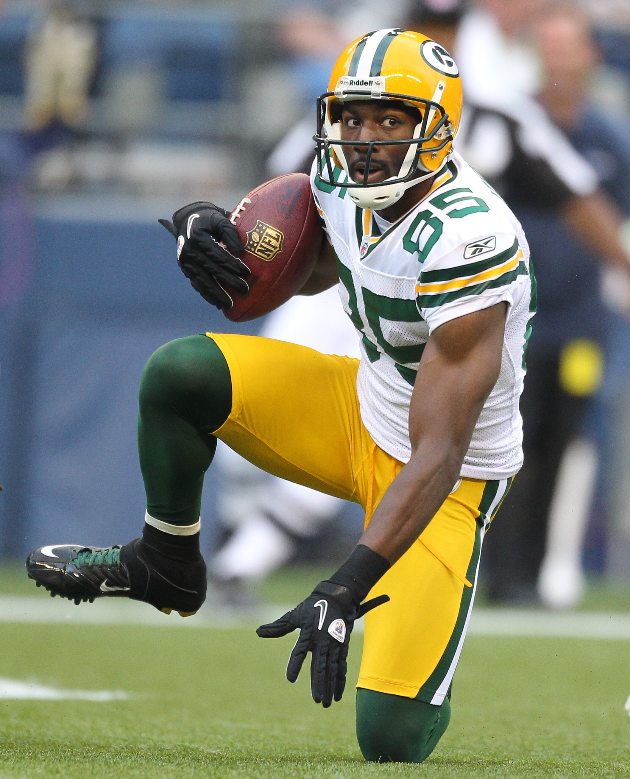 SEATTLE - AUGUST 21:  Wide receiver Greg Jennings #85 of the Green Bay Packers gets up after making a diving catch during the preseason game against Earl Thomas #29 of the Seattle Seahawks at Qwest Field on August 21, 2010 in Seattle, Washington. (Photo b