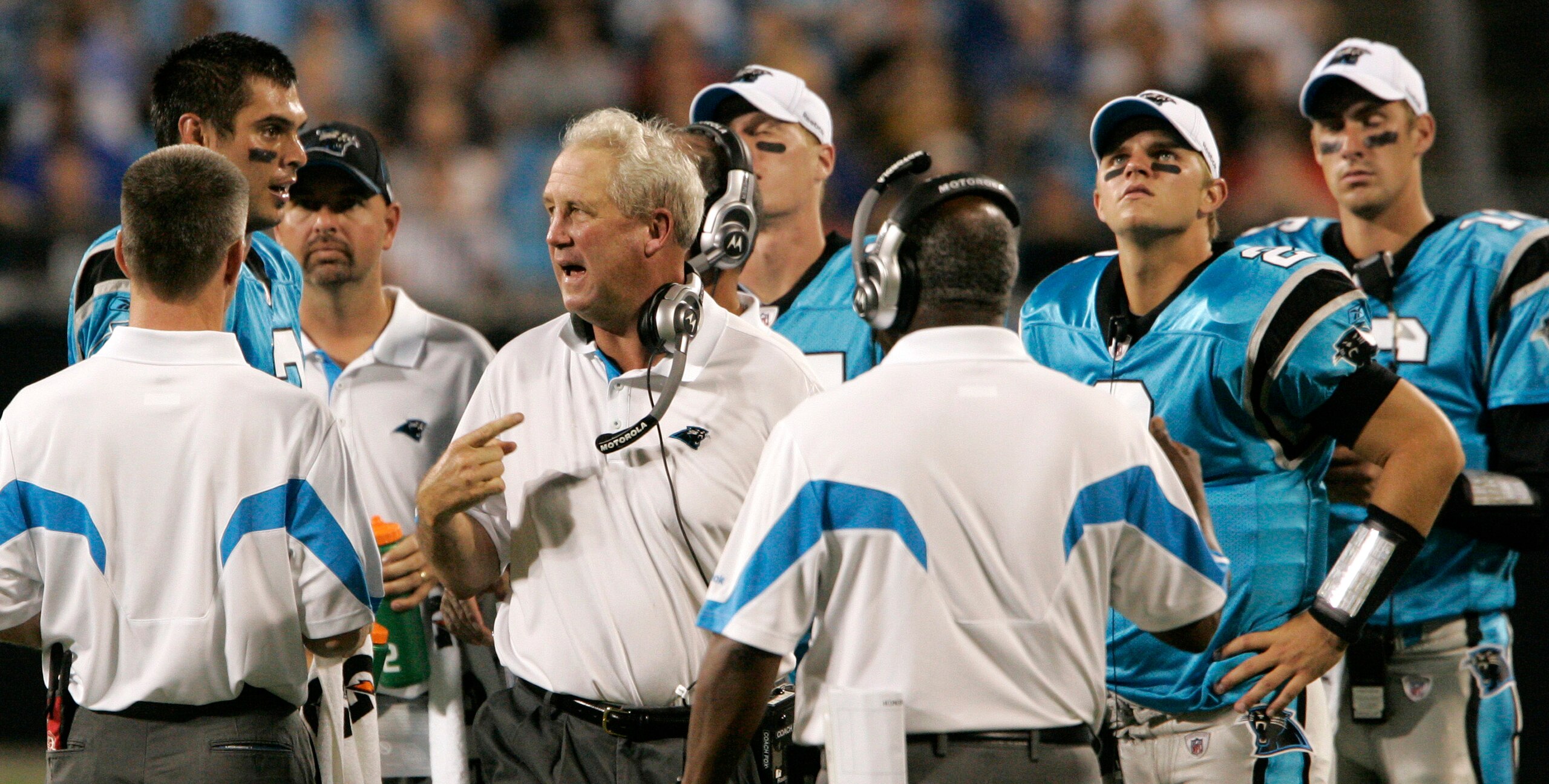 CHARLOTTE, NC _ AUGUST 28: John Fox, center, talks to his quarterback Matt Moore #3, left during a time out of their preseason game against the Tennessee Titans at Bank of America Stadium on August 28, 2010 in Charlotte, North Carolina. (Photo by Mary Ann