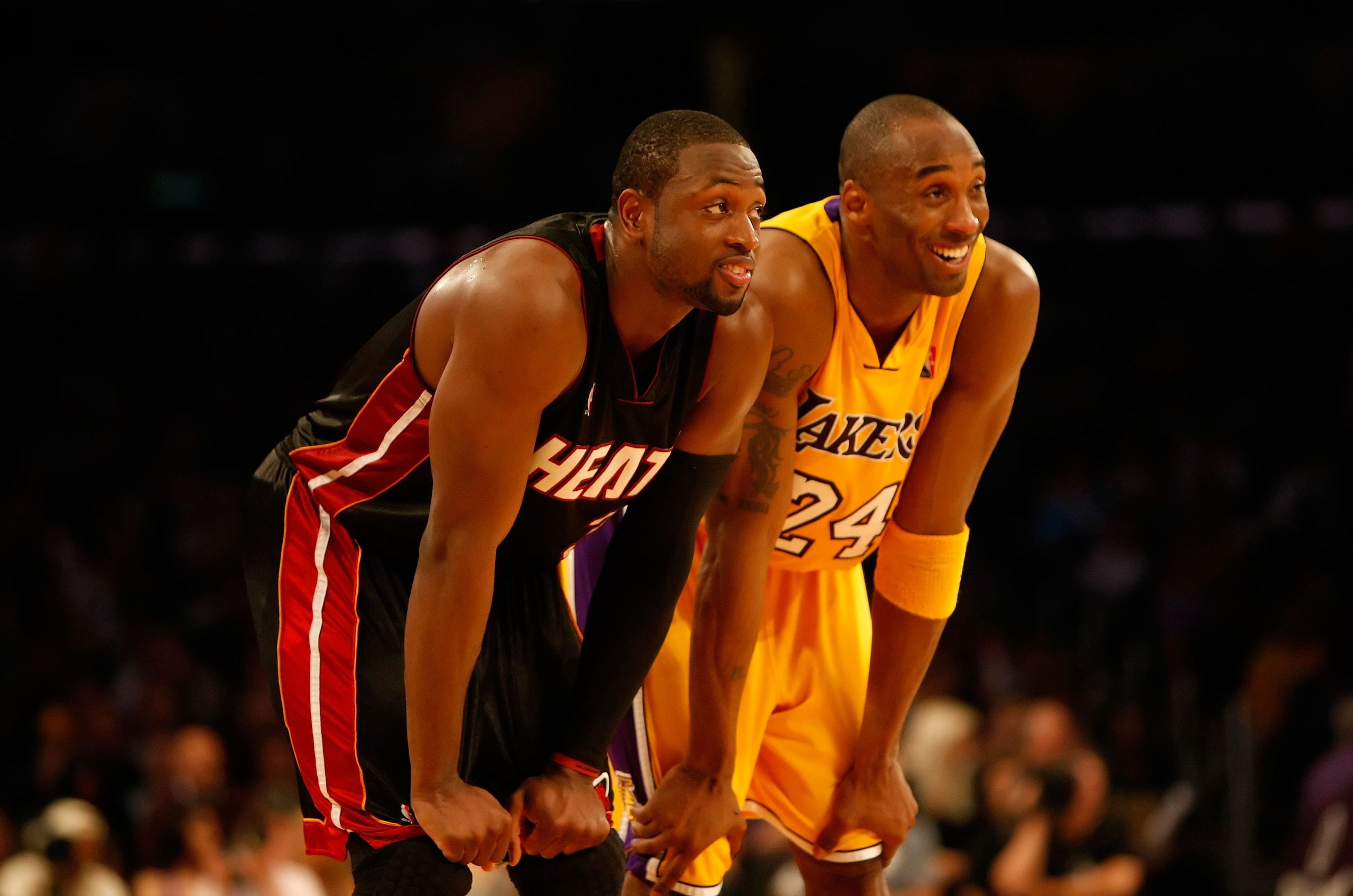 LOS ANGELES, CA - DECEMBER 04: Kobe Bryant #24 of the Los Angeles Lakers and Dwayne Wade #3 of the Miami Heat share a laugh in the fourth quarter at Staples Center on December 4, 2009 in Los Angeles, California. The Lakers defeated the Heat 108-107. NOTE LOS ANGELES, CA - DECEMBER 04: Kobe Bryant #24 of the Los Angeles Lakers and Dwayne Wade #3 of the Miami Heat share a laugh in the fourth quarter at Staples Center on December 4, 2009 in Los Angeles, California. The Lakers defeated the Heat 108-107. NOTE