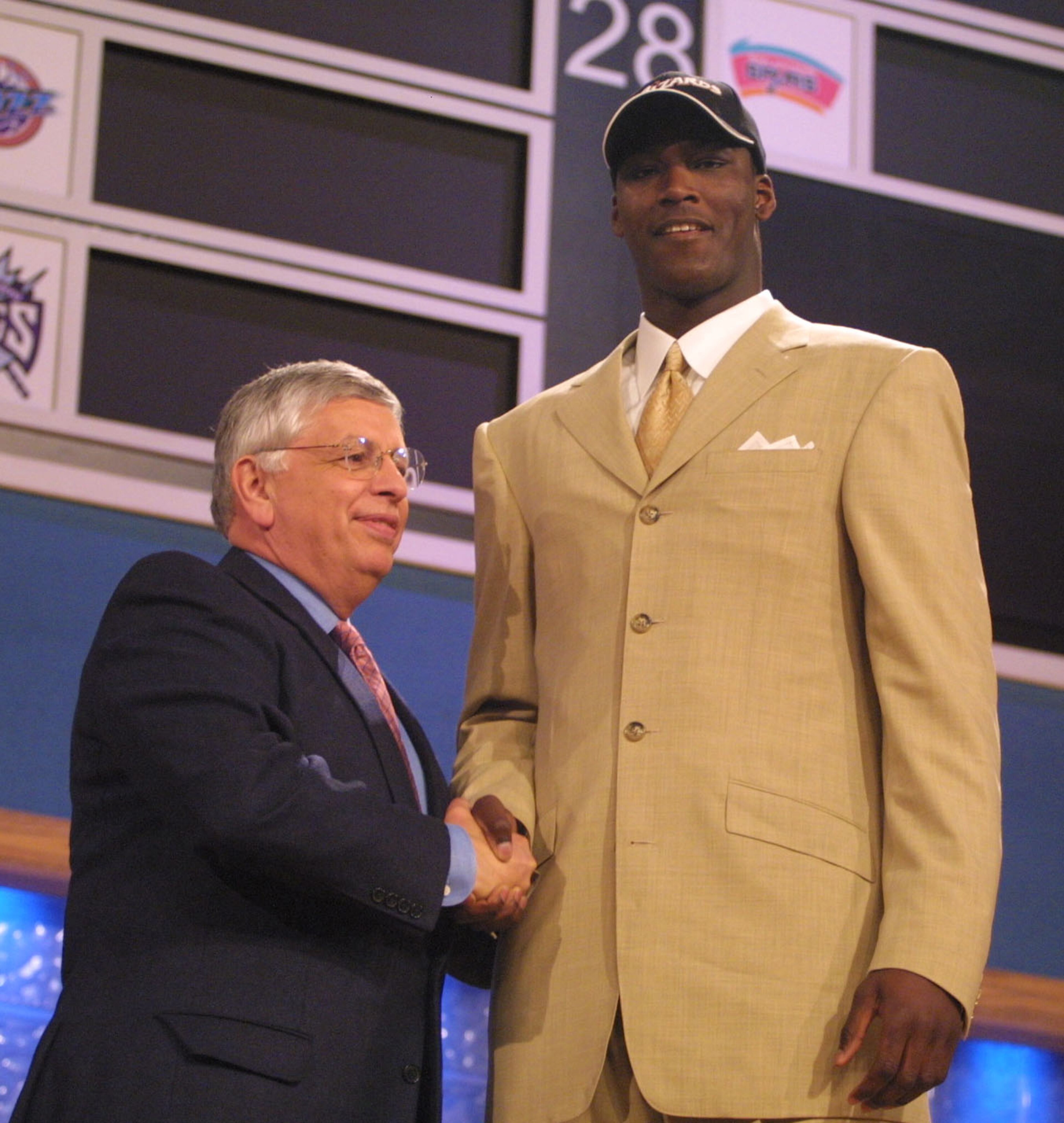 27 Jun 2001:  NBA Commisioner David Stern congratulates Kwame Brown of Glynn Acadamy in Georgia, after being the first pick in the NBA Draft by the Washington Wizards at the Theatre in Madison Square Garden, New York City. Mandatory Credit: Al Bello/ALLSP