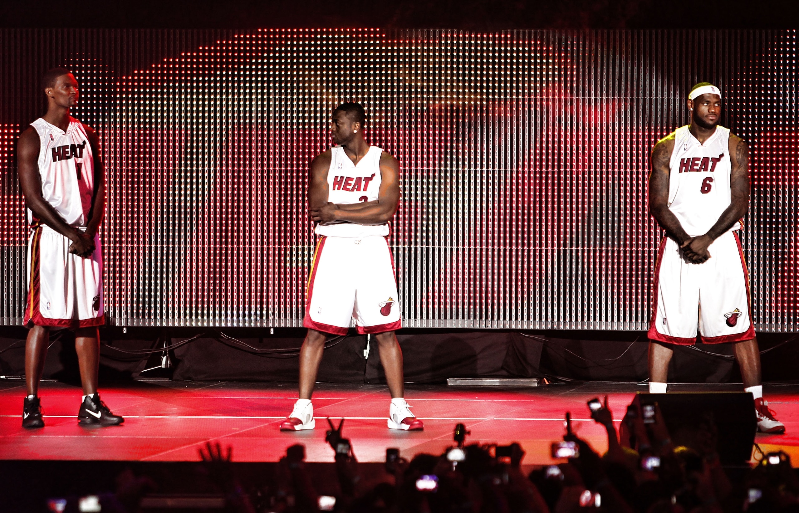 MIAMI - JULY 09: Fans cheer as (L-R) Chris Bosh #1, Dwyane Wade #3, and LeBron James #6 of the Miami Heat are introduced during a welcome party at American Airlines Arena on July 9, 2010 in Miami, Florida. (Photo by Marc Serota/Getty Images) MIAMI - JULY 09: Fans cheer as (L-R) Chris Bosh #1, Dwyane Wade #3, and LeBron James #6 of the Miami Heat are introduced during a welcome party at American Airlines Arena on July 9, 2010 in Miami, Florida. (Photo by Marc Serota/Getty Images)