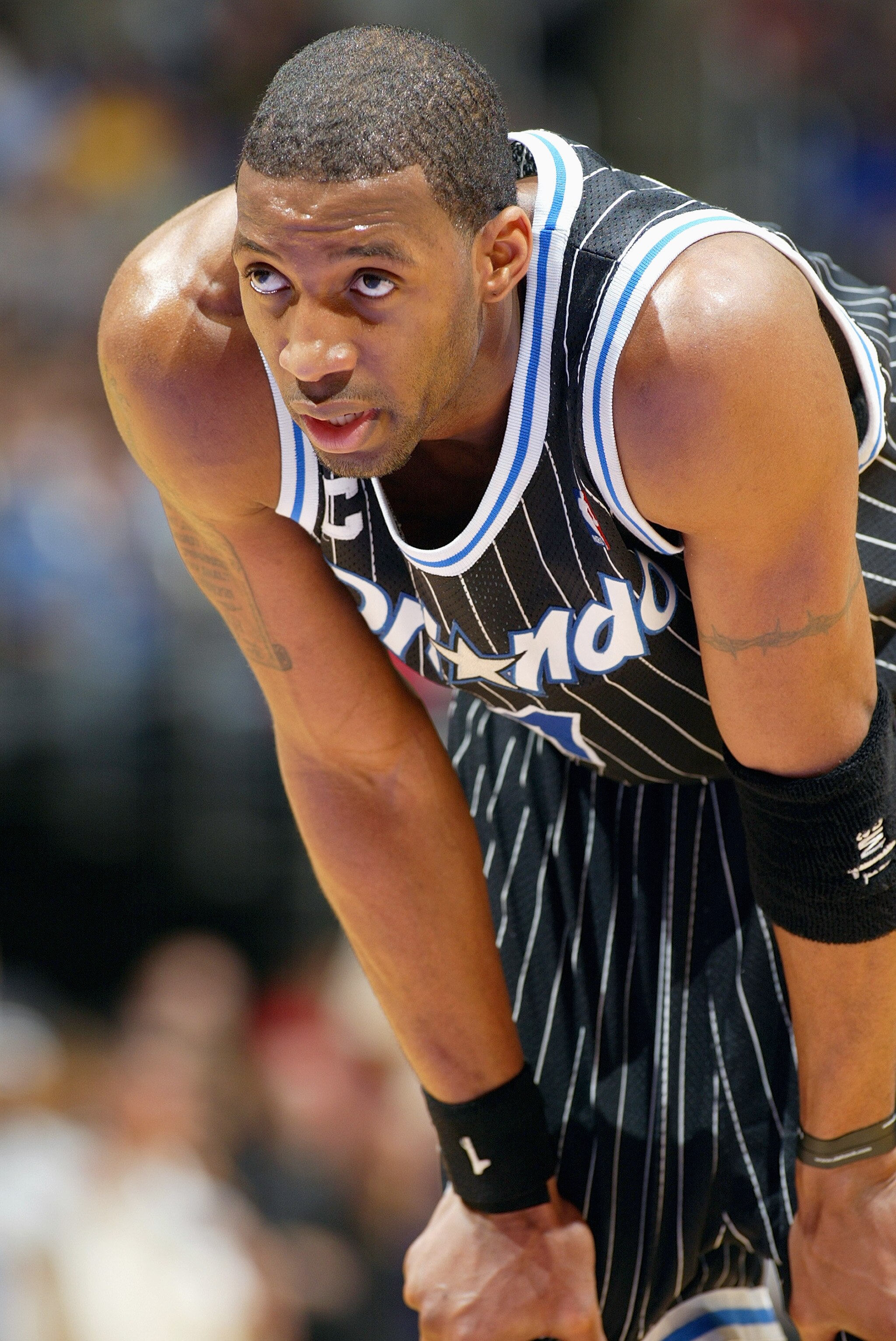 LOS ANGELES - MARCH 15:  Tracy McGrady #1 of the Orlando Magic looks on during the game against the Los Angeles Lakers at Staples Center on March 15, 2004 in Los Angeles, California.  The Lakers won 113-110.   NOTE TO USER: User expressly acknowledges and