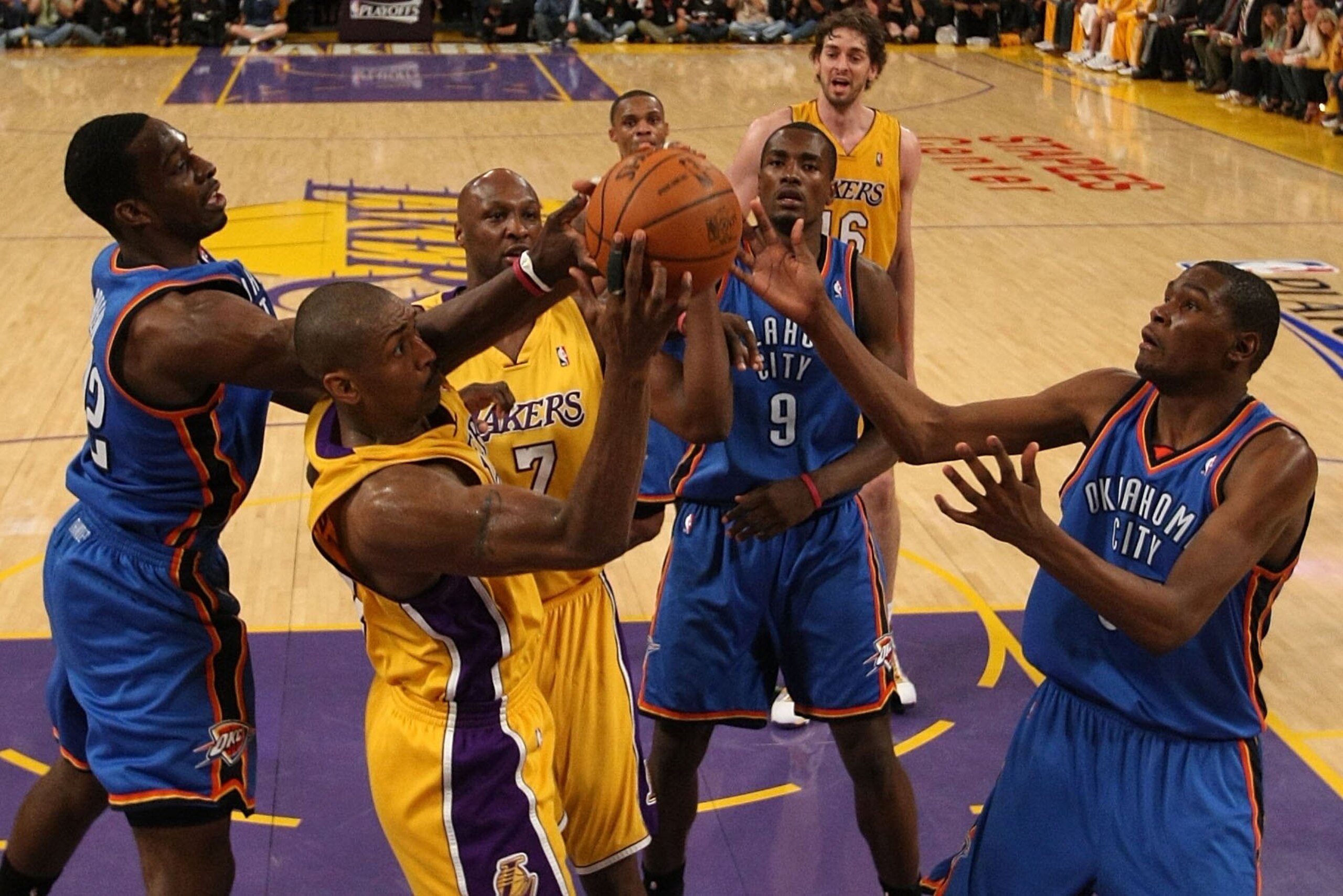 LOS ANGELES, CA - APRIL 27: Ron Artest #37 of the Los Angeles Lakers rebounds the ball between Jeff Green #22 and Kevin Durant #35 of the Oklahoma City Thunder during Game Five of the Western Conference Quarterfinals of the 2010 NBA Playoffs at Staples C LOS ANGELES, CA - APRIL 27: Ron Artest #37 of the Los Angeles Lakers rebounds the ball between Jeff Green #22 and Kevin Durant #35 of the Oklahoma City Thunder during Game Five of the Western Conference Quarterfinals of the 2010 NBA Playoffs at Staples C