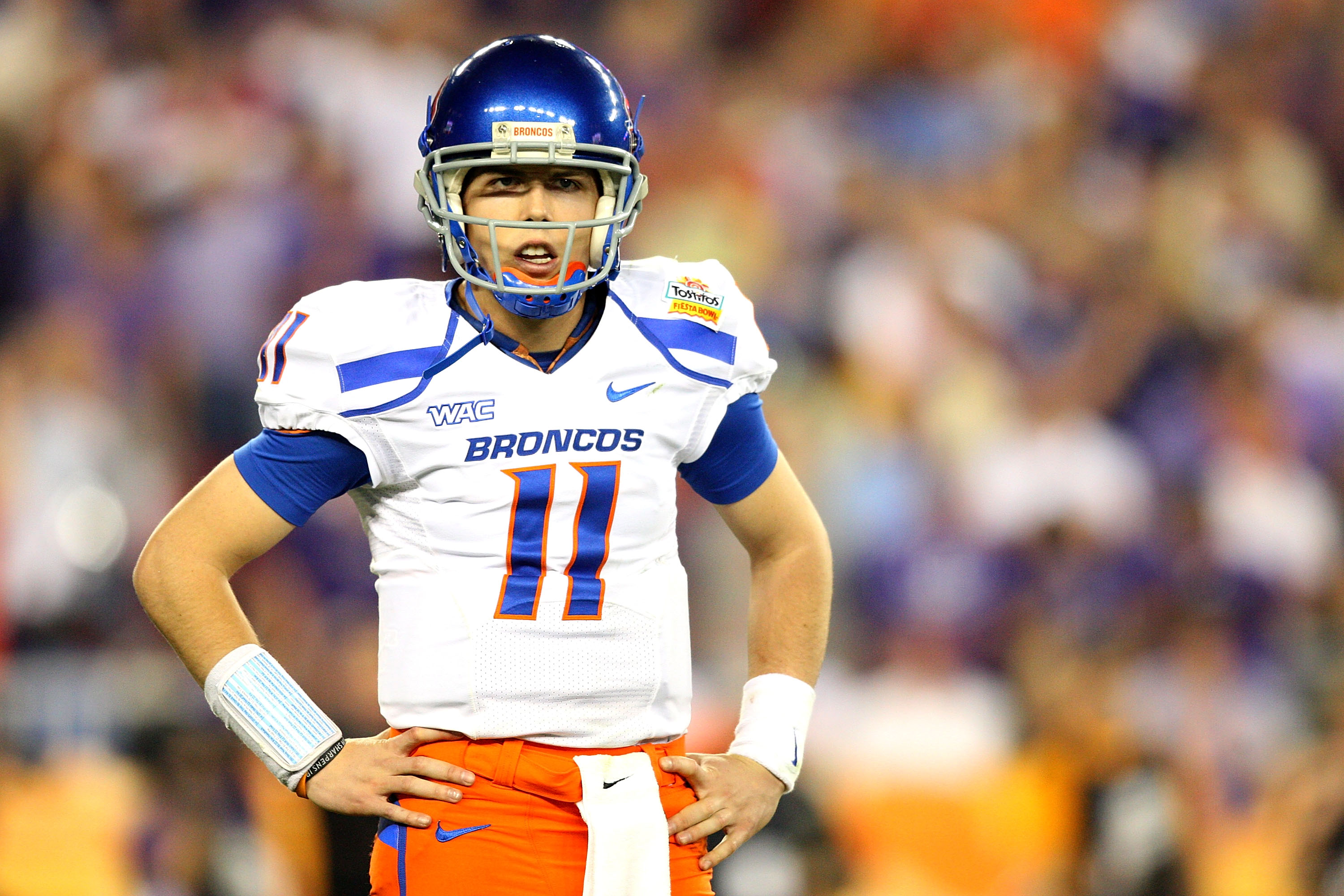 GLENDALE, AZ - JANUARY 04:  Quarterback Kellen Moore #11 of the Boise State Broncos looks over to his sideline in the second half against the TCU Horned Frogs during the Tostitos Fiesta Bowl at the Universtity of Phoenix Stadium on January 4, 2010 in Glen