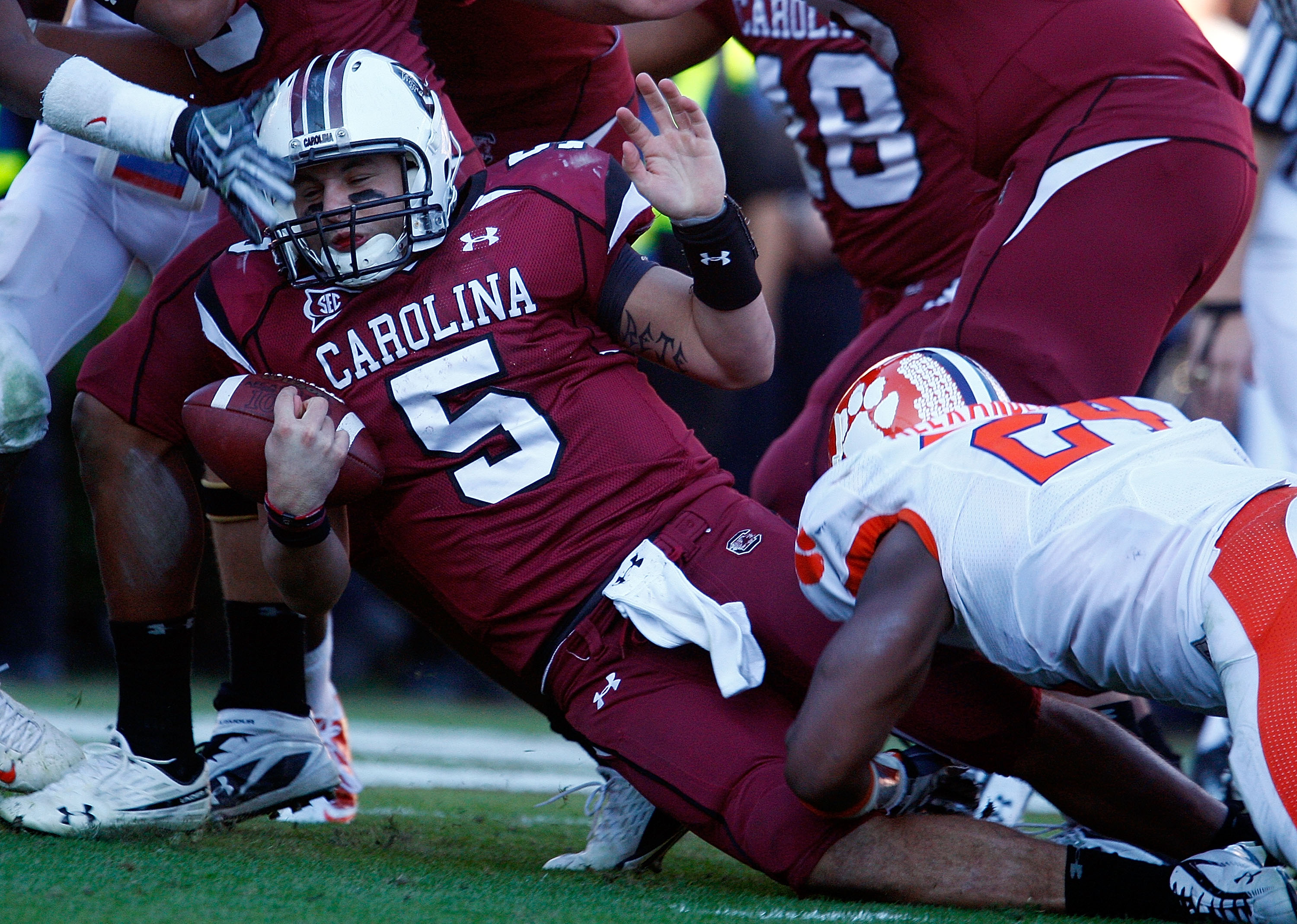 COLUMBIA, SC - NOVEMBER 28:  Stephen Garcia #5 of the South Carolina Gamecocks is tackled by Kevin Alexander #24 of the Clemson Tigers at Williams-Brice Stadium on November 28, 2009 in Columbia, South Carolina.  (Photo by Scott Halleran/Getty Images)