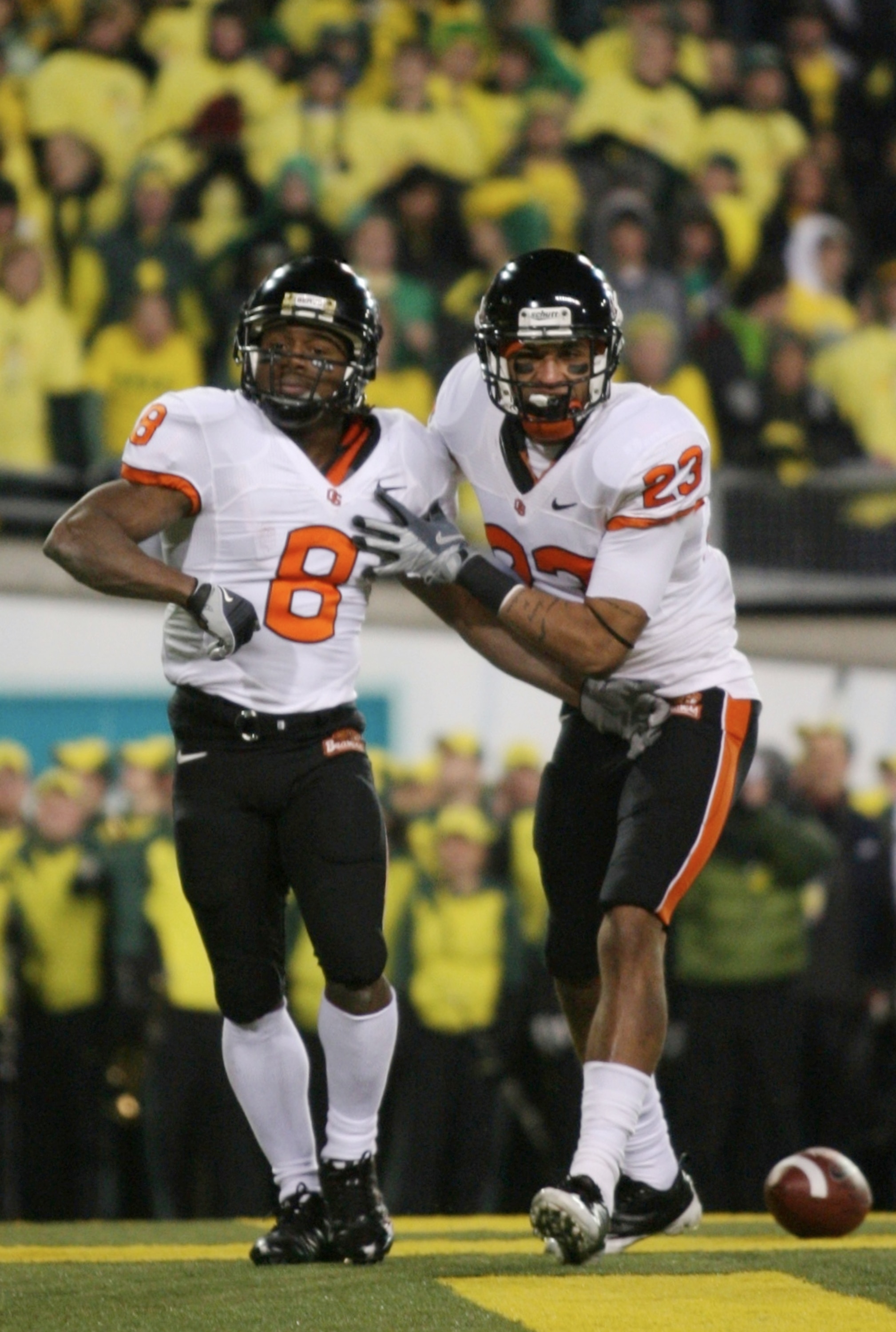 EUGENE,OR - DECEMBER 03:  Wide receiver James Rodgers #8 of Oregon State Beavers acelebrates scoring a touchdown with teammate Jordan Bishop #23 during the second quarter of the game against the Oregon Ducks at Autzen Stadium on December 3, 2009 in Eugene