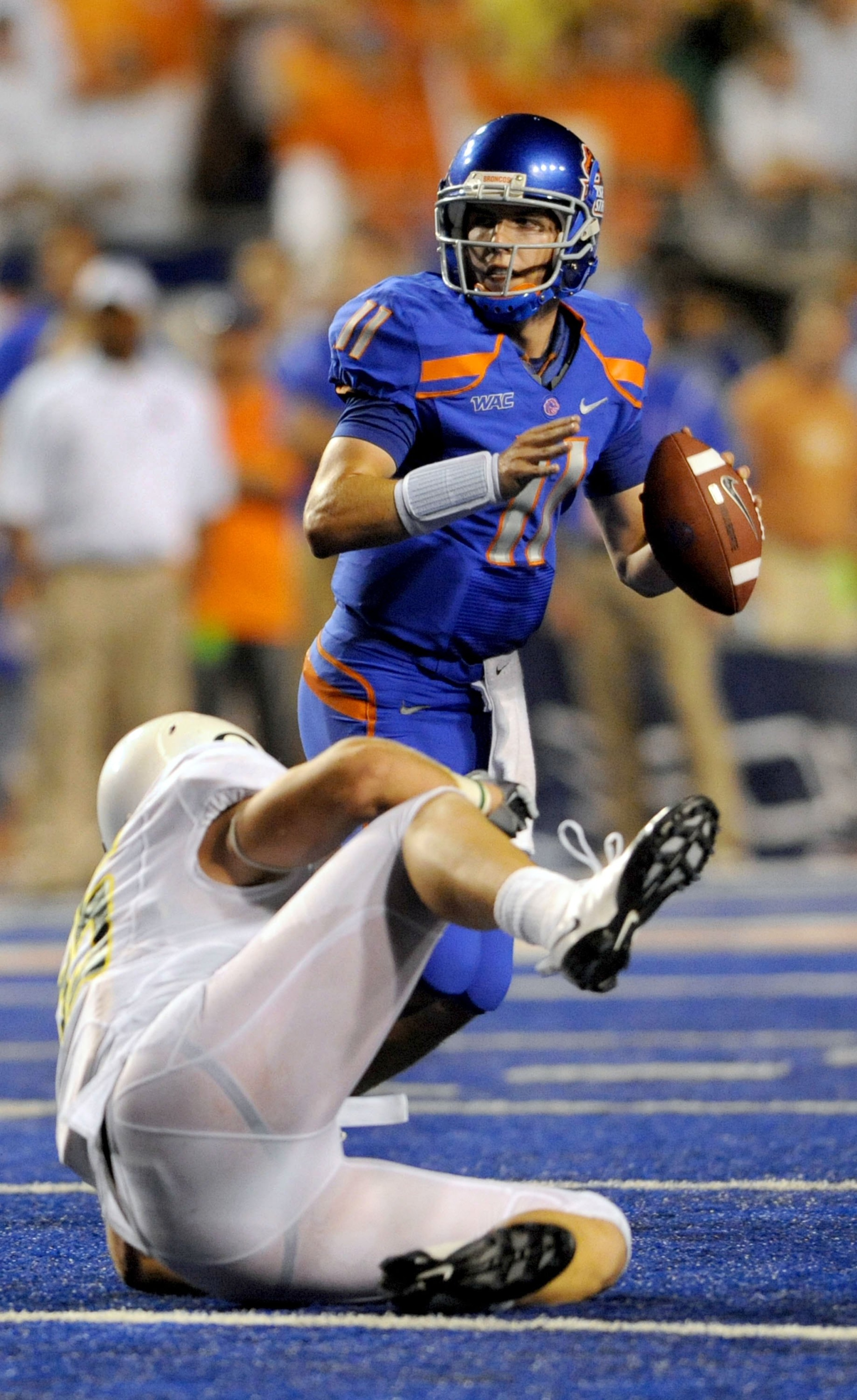 BOISE, ID - SEPTEMBER 3: Quarterback Kellen Moore #6 of the Boise State Broncos looks to throw a pass in the third quarter of the game against the Oregon Ducks at Bronco Stadium on September 3, 2009 in Boise, Idaho. Boise State won the game 19-8. (Photo b BOISE, ID - SEPTEMBER 3: Quarterback Kellen Moore #6 of the Boise State Broncos looks to throw a pass in the third quarter of the game against the Oregon Ducks at Bronco Stadium on September 3, 2009 in Boise, Idaho. Boise State won the game 19-8. (Photo b