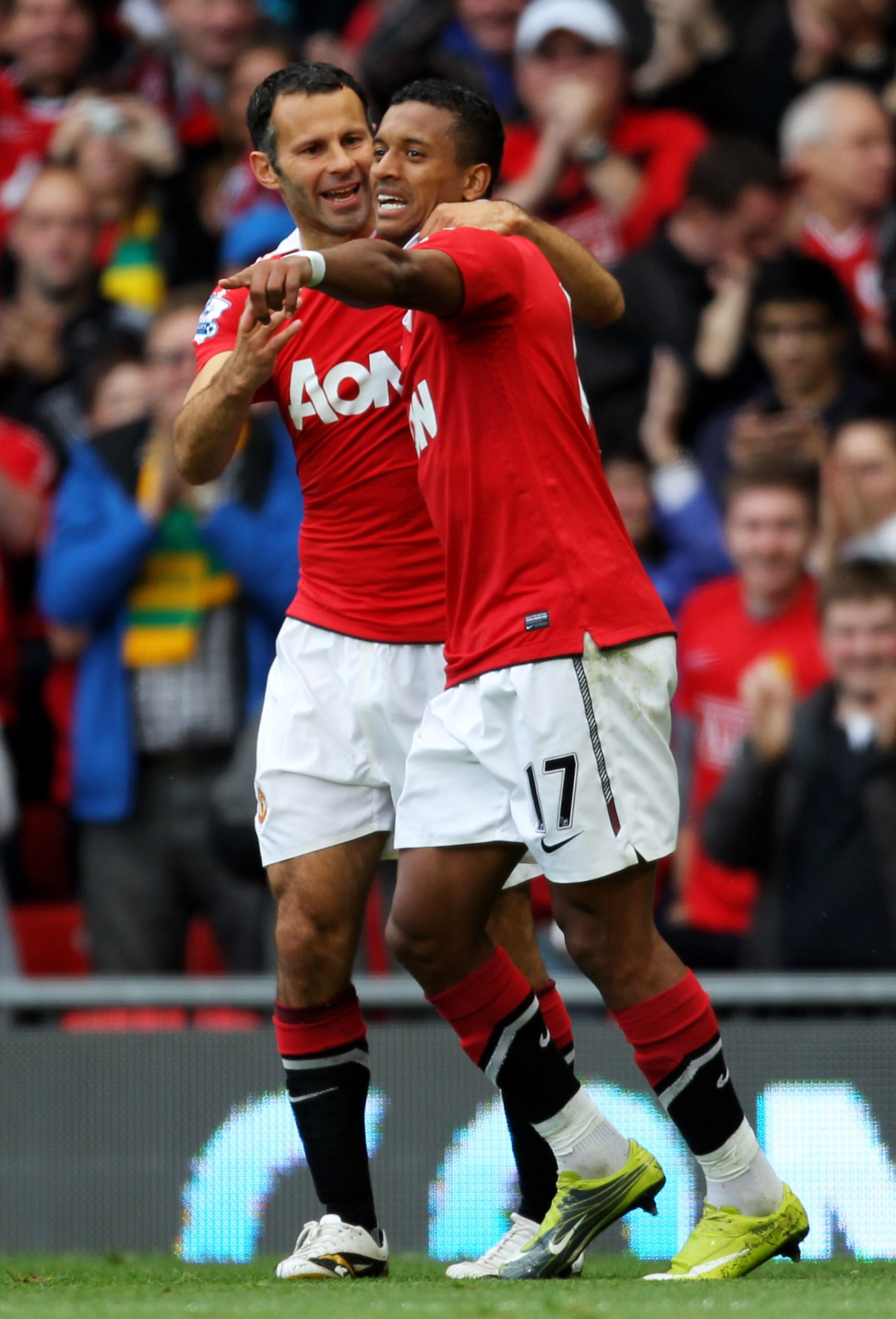 MANCHESTER, ENGLAND - AUGUST 28:  Nani of Manchester United is congratulated by team mate Ryan Giggs (L) after scoring his team's second goal during the Barclays Premier League match between Manchester United and West Ham United at Old Trafford on August