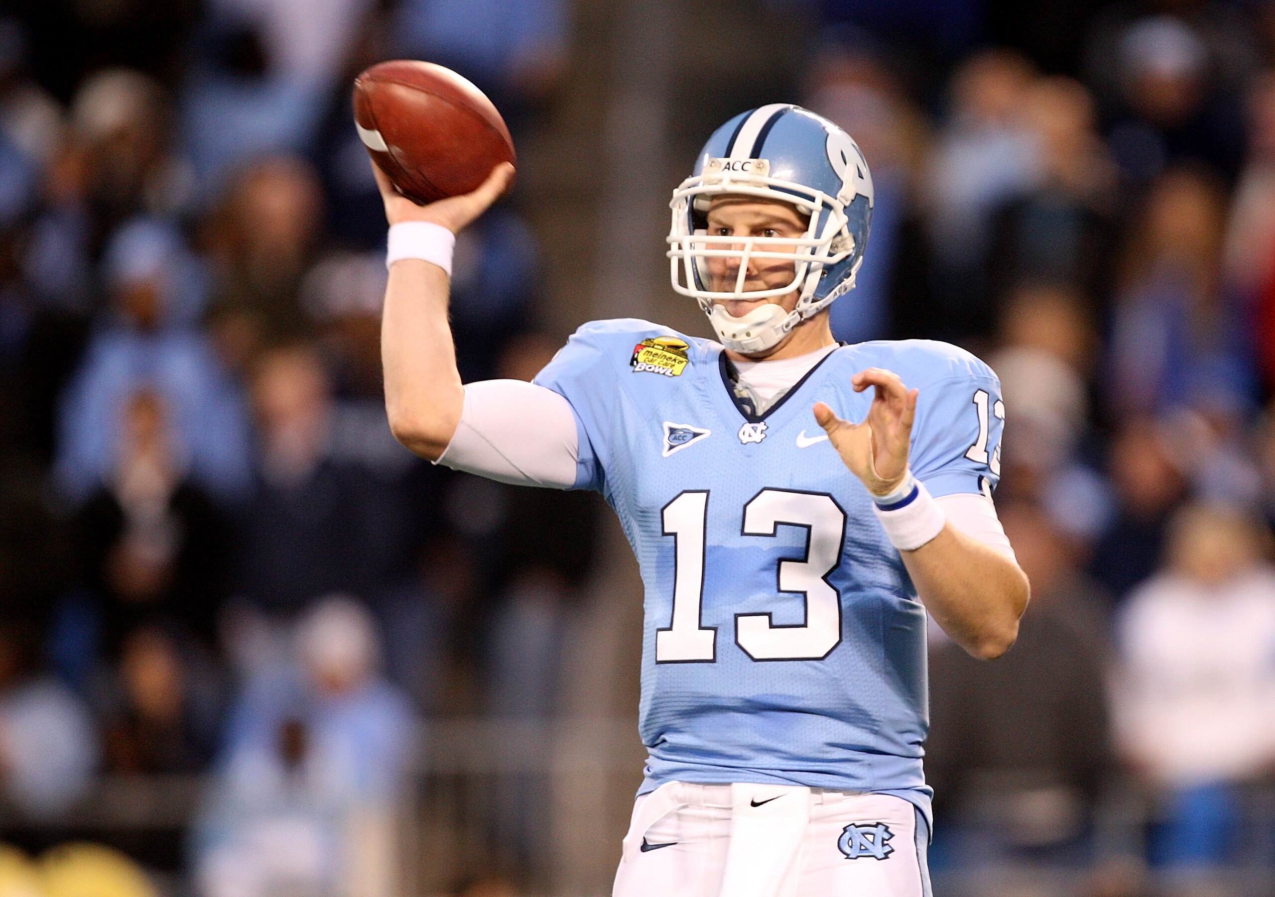 CHARLOTTE, NC - DECEMBER 26:  T.J. Yates #13 of the North Carolina Tar Heels throws a pass against the Pittsburgh Panthers during their game on December 26, 2009 in Charlotte, North Carolina.  (Photo by Streeter Lecka/Getty Images)