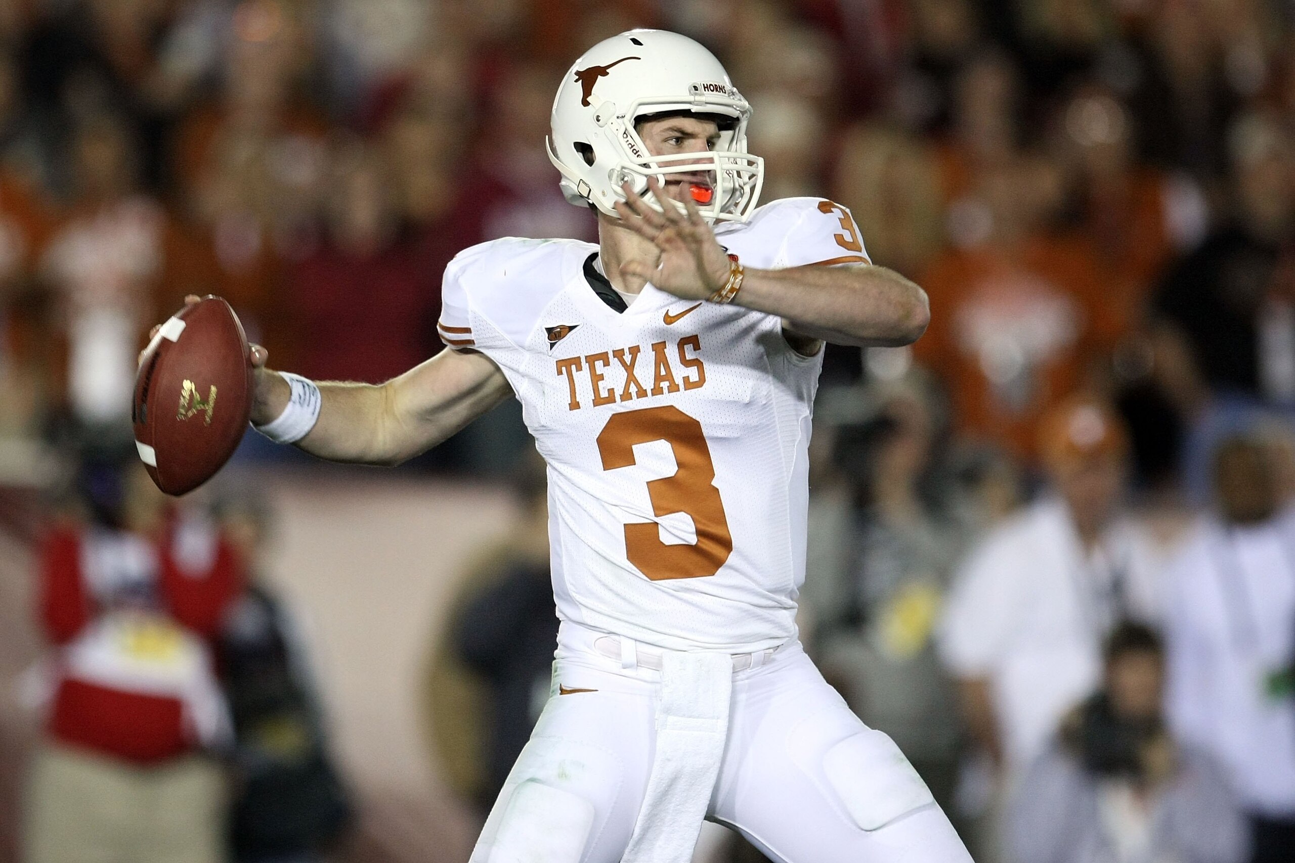 PASADENA, CA - JANUARY 07:  Quarterback Garrett Gilbert #3 of the Texas Longhorns drops back to pass against the Alabama Crimson Tide during the Citi BCS National Championship game at the Rose Bowl on January 7, 2010 in Pasadena, California.  (Photo by St