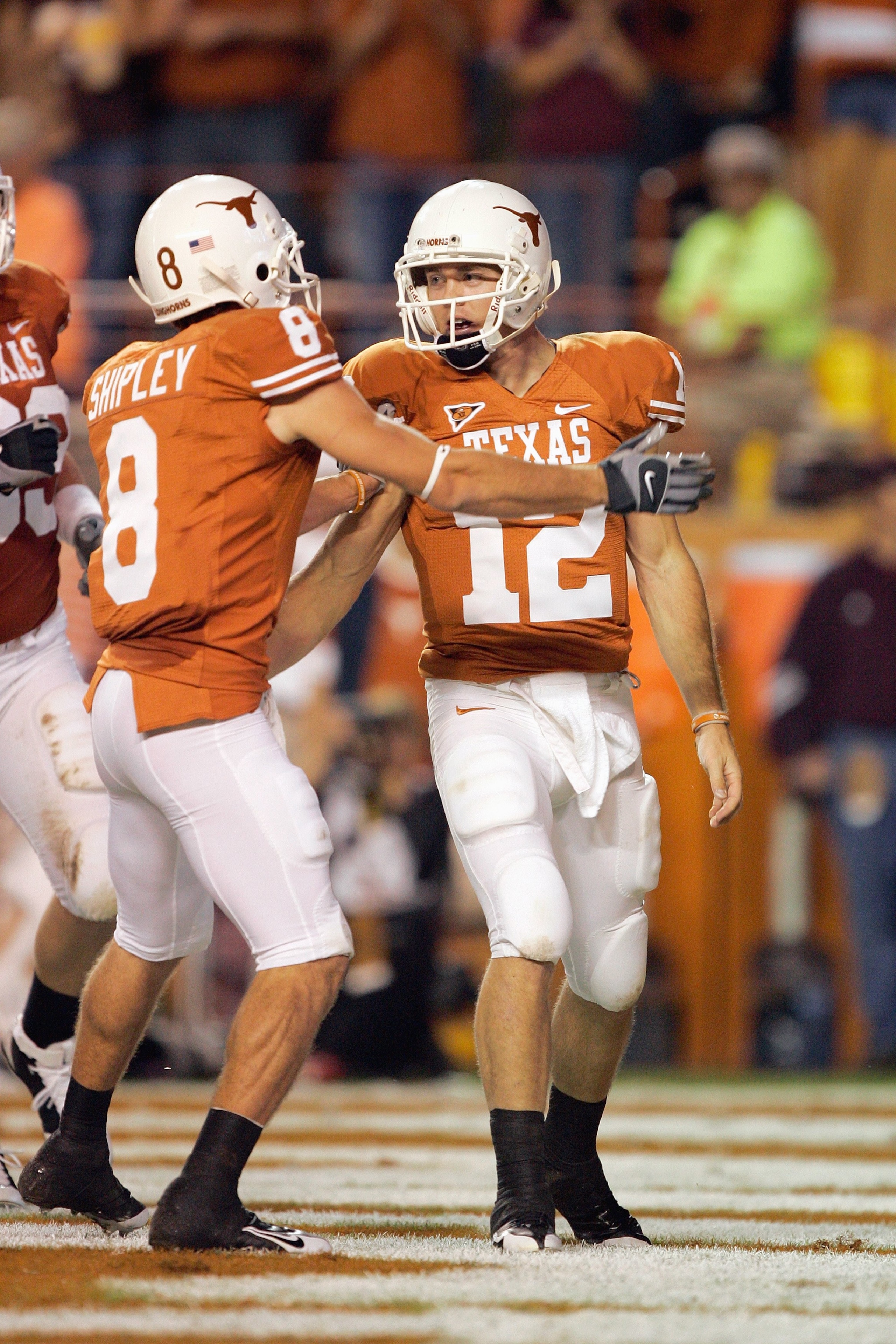 AUSTIN, TX - NOVEMBER 27:  Quarterback Colt McCoy #12 of the Texas Longhorns is congratulated by Jordan Shipley #8 during the game against the Texas A&M Aggies on November 27, 2008 at Darrell K Royal-Texas Memorial Stadium in Austin, Texas.  Texas won 49-