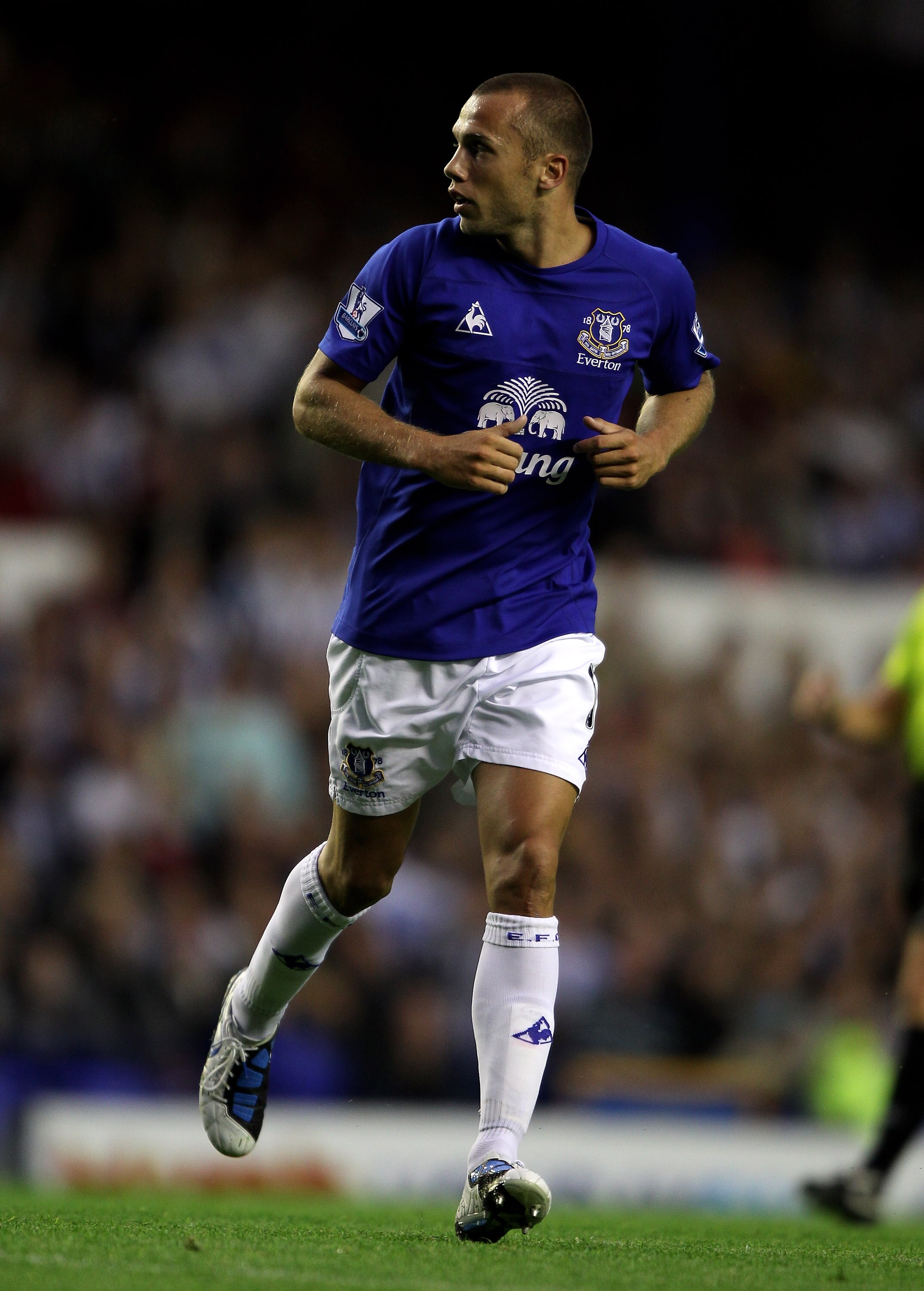 LIVERPOOL, ENGLAND - AUGUST 25: John Heitinga of Everton in action during the Carling Cup second round match between Everton and Huddersfield Town at Goodison Park on August 25, 2010 in Liverpool, England.  (Photo by Clive Brunskill/Getty Images)