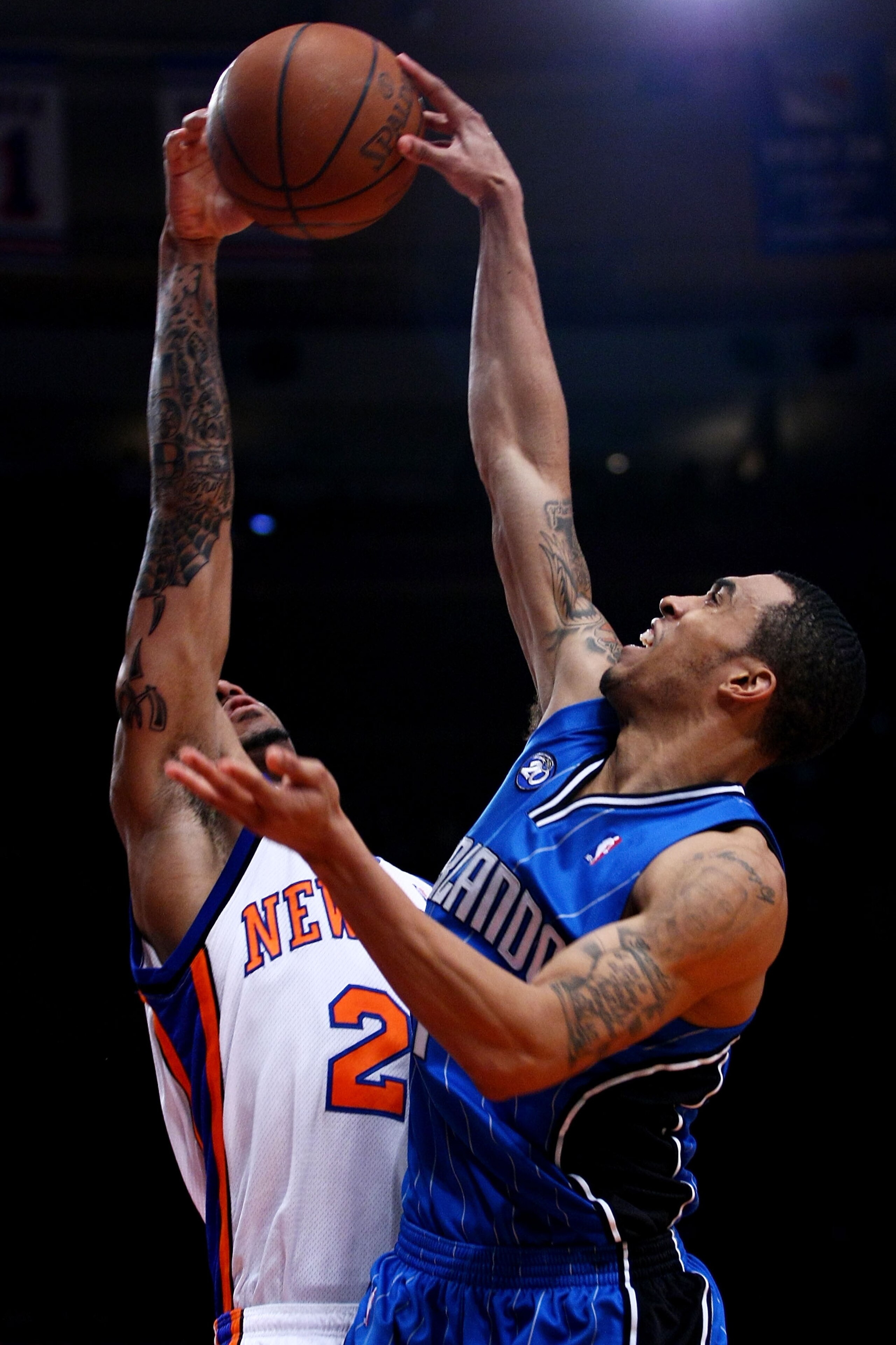 NEW YORK - FEBRUARY 25:  Courtney Lee #11 of the Orlando Magic tries to shoot over Wilson Chandler #21 of the New York Knicks at Madison Square Garden February 25, 2009 in New York City. NOTE TO USER: User expressly acknowledges and agrees that, by downlo