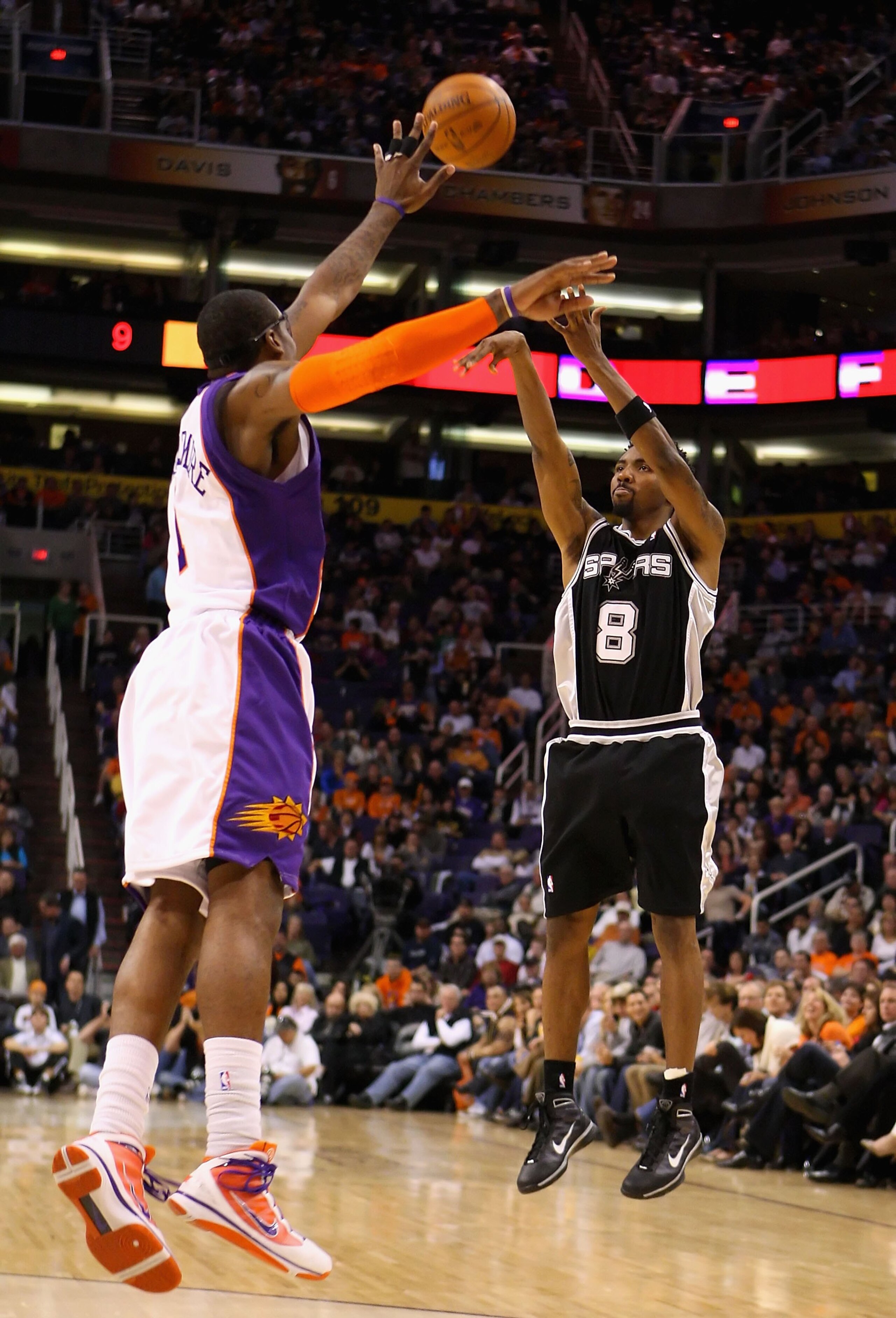 PHOENIX - DECEMBER 15:  Roger Mason Jr. #8 of the San Antonio Spurs puts up a shot during the NBA game against the Phoenix Suns at US Airways Center on December 15, 2009 in Phoenix, Arizona. The Suns defeated the Spurs 116-104. NOTE TO USER: User expressl