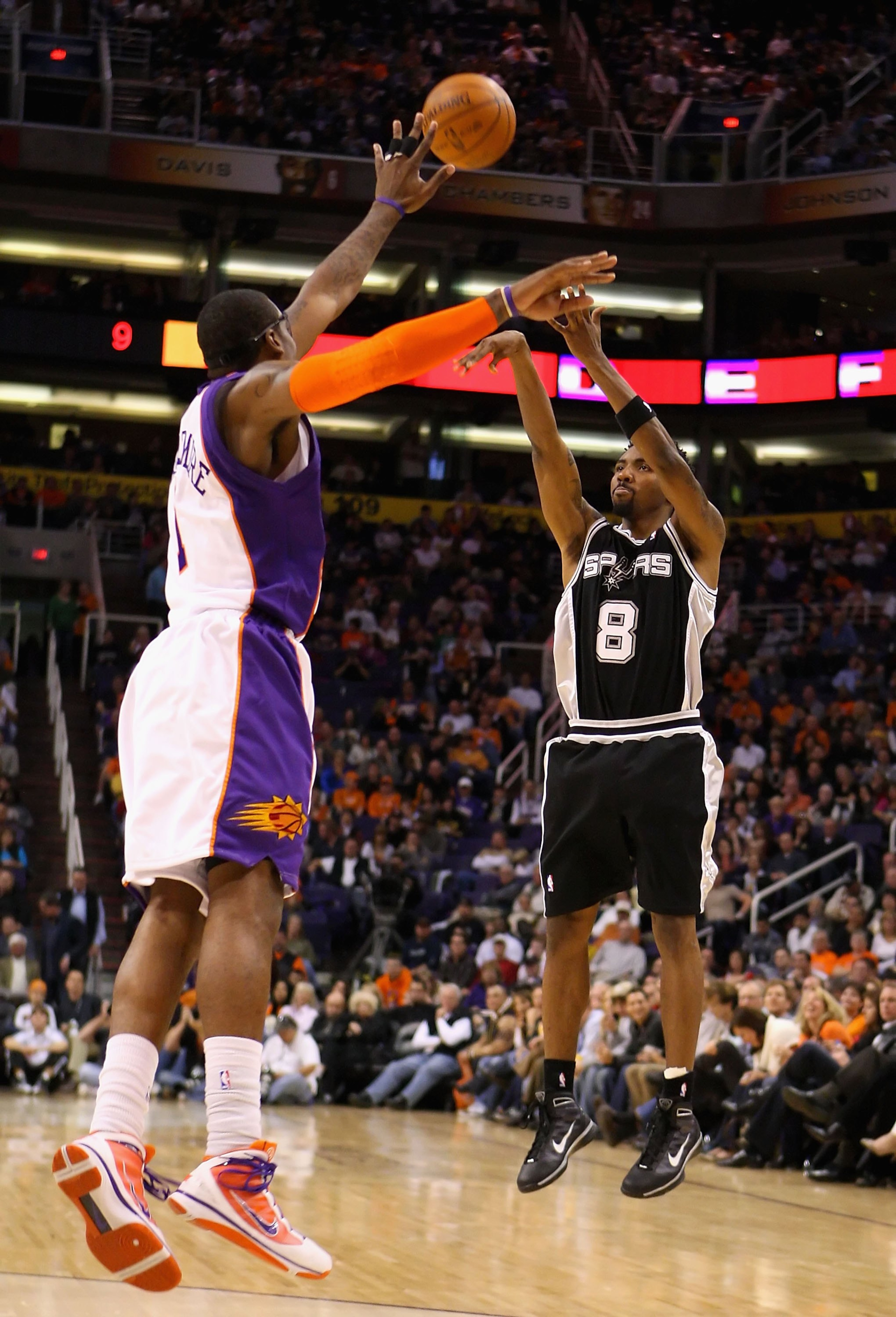 PHOENIX - DECEMBER 15:  Roger Mason Jr. #8 of the San Antonio Spurs puts up a shot during the NBA game against the Phoenix Suns at US Airways Center on December 15, 2009 in Phoenix, Arizona. The Suns defeated the Spurs 116-104. NOTE TO USER: User expressl
