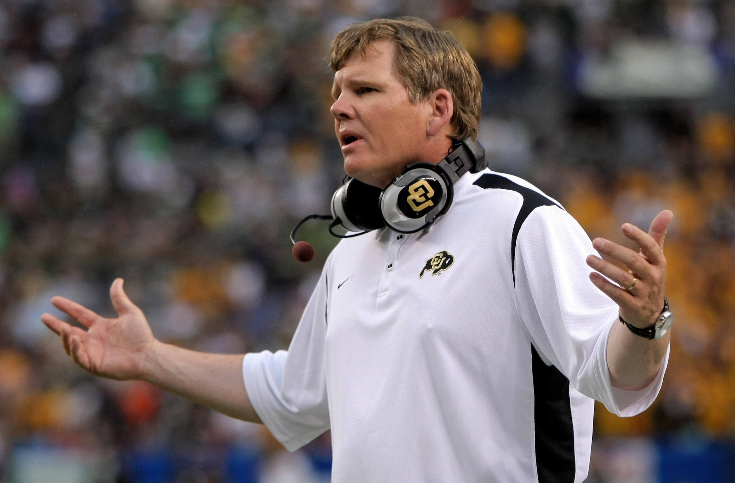 DENVER - AUGUST 31:  Head coach Dan Hawkins of the University of Colorado Buffaloes protests a call to the officials against the Colorado State University Rams at Invesco Field at Mile High on August 31, 2008 in Denver, Colorado.  (Photo by Doug Pensinger