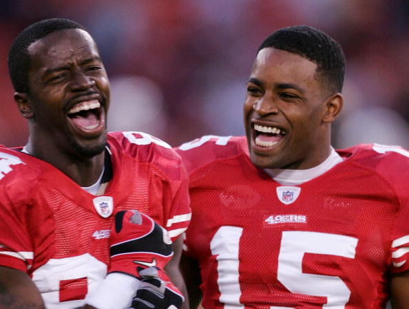 SAN FRANCISCO - DECEMBER 14:  Wide receivers Josh Morgan #84 and Michael Crabtree #15 of the San Francisco 49ers laugh on the field prior to their game against the Arizona Cardinals at Candlestick Park on December 14, 2009 in San Francisco, California. (P