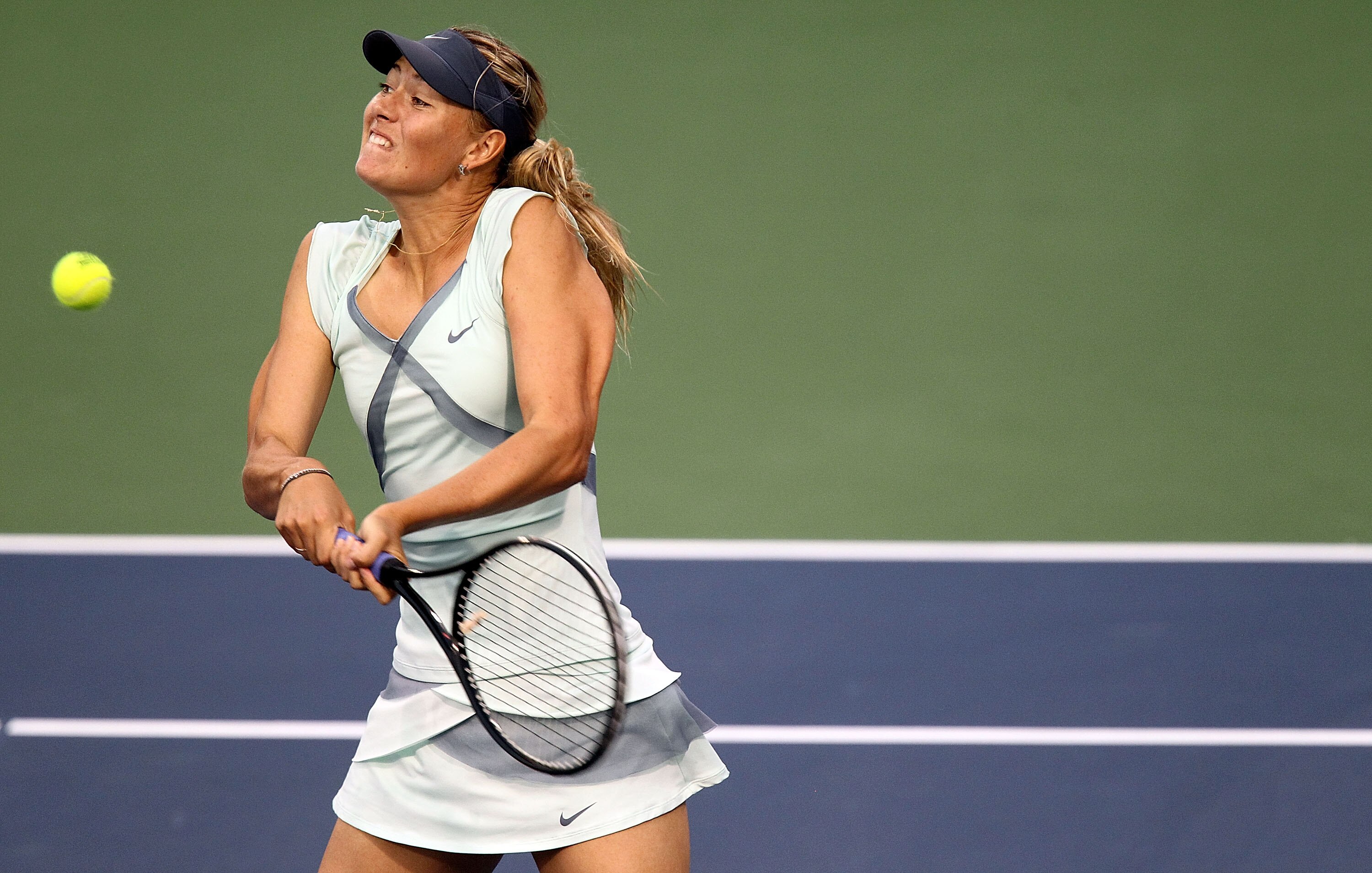 CINCINNATI - AUGUST 14:  Maria Sharapova of Russia hits a backhand return during her semifinal match against Anastasia Pavlyuchenkova of Russia  on day six of the Western & Southern Financial Group Women's Open on August 14, 2010 at the Lindner Family Ten