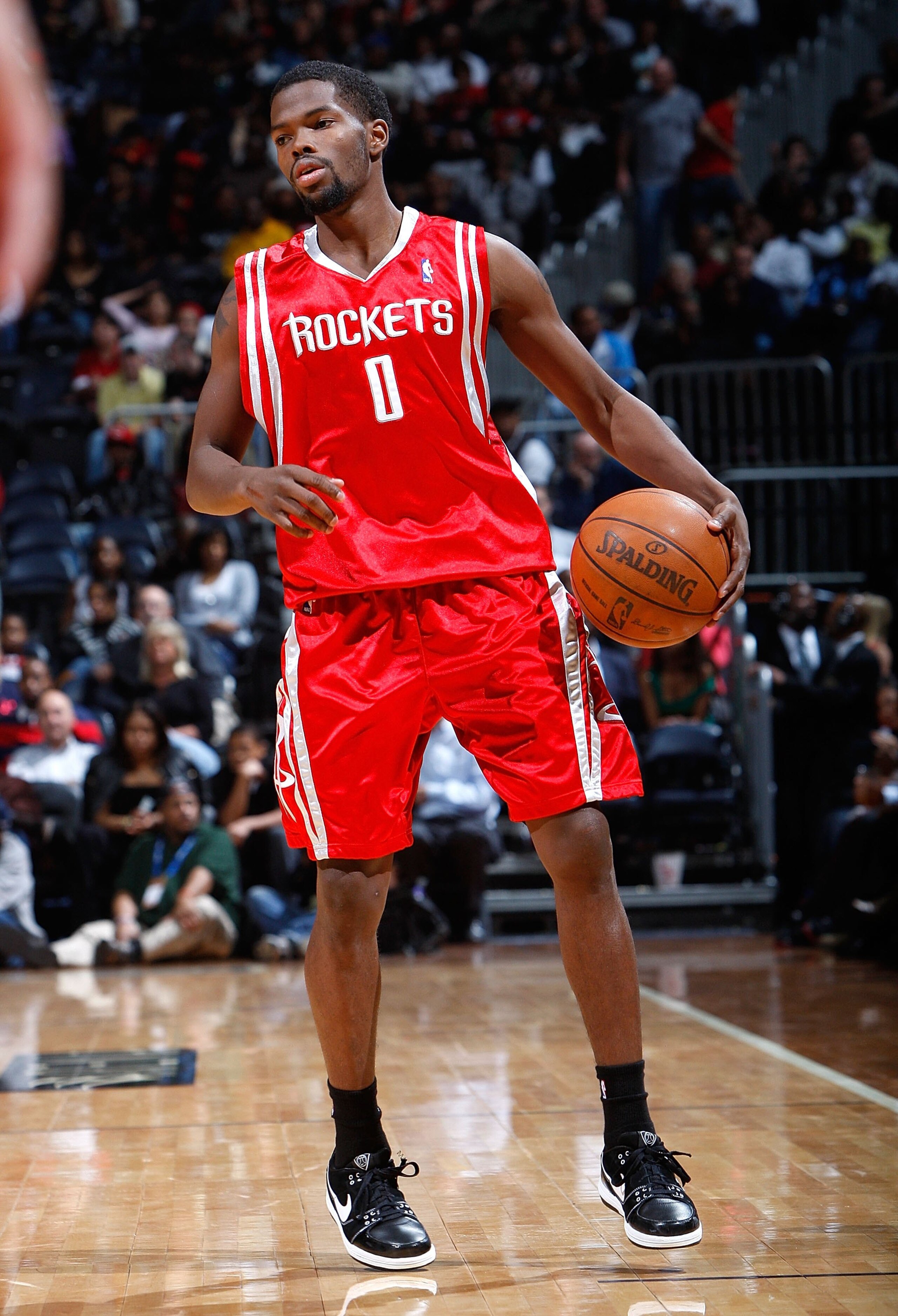 ATLANTA - NOVEMBER 20:  Aaron Brooks #0 of the Houston Rockets against the Atlanta Hawks at Philips Arena on November 20, 2009 in Atlanta, Georgia.  NOTE TO USER: User expressly acknowledges and agrees that, by downloading and/or using this Photograph, Us