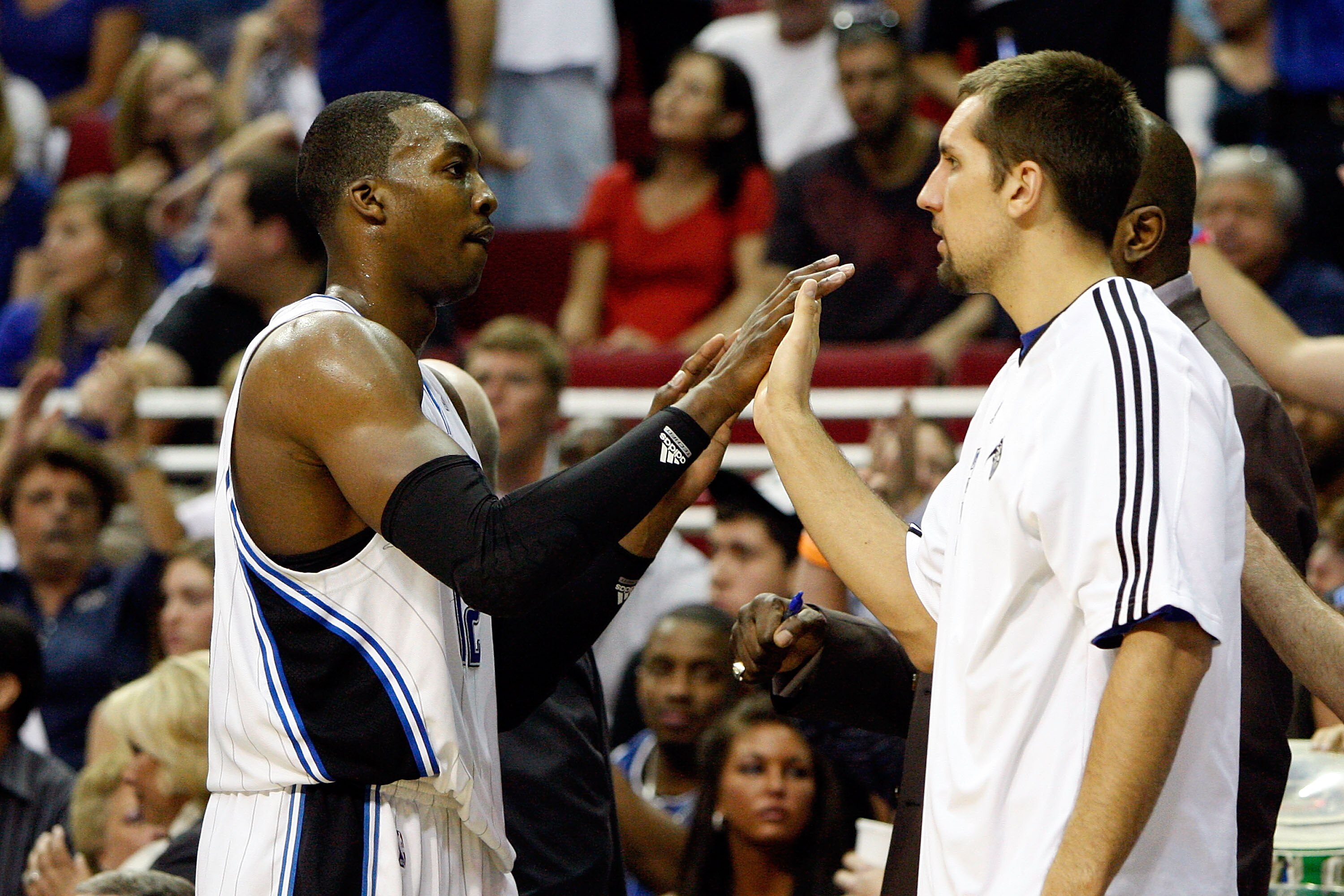 ORLANDO, FL - MAY 26:  Dwight Howard #12 of the Orlando Magic greets Ryan Anderson as he returns to the bench against the Boston Celtics in Game Five of the Eastern Conference Finals during the 2010 NBA Playoffs at Amway Arena on May 26, 2010 in Orlando,