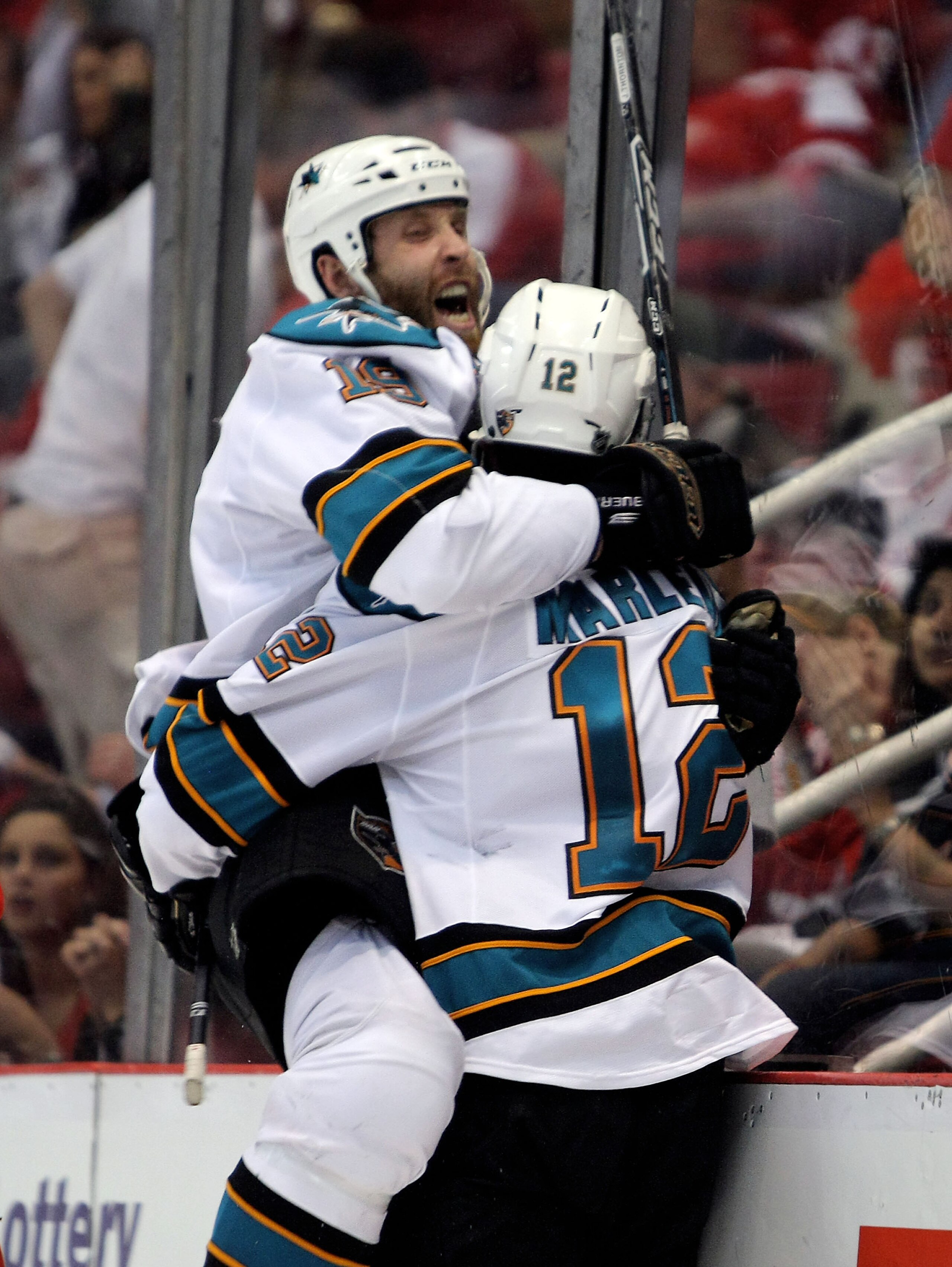 DETROIT - MAY 4:  Patrick Marleau #12 of the San Jose Sharks celebrates his overtime game-winning goal with teammate Joe Thornton #19 who assisted on the goal against the Detroit Red Wings in Game Three of the Western Conference Semifinals during the 2010