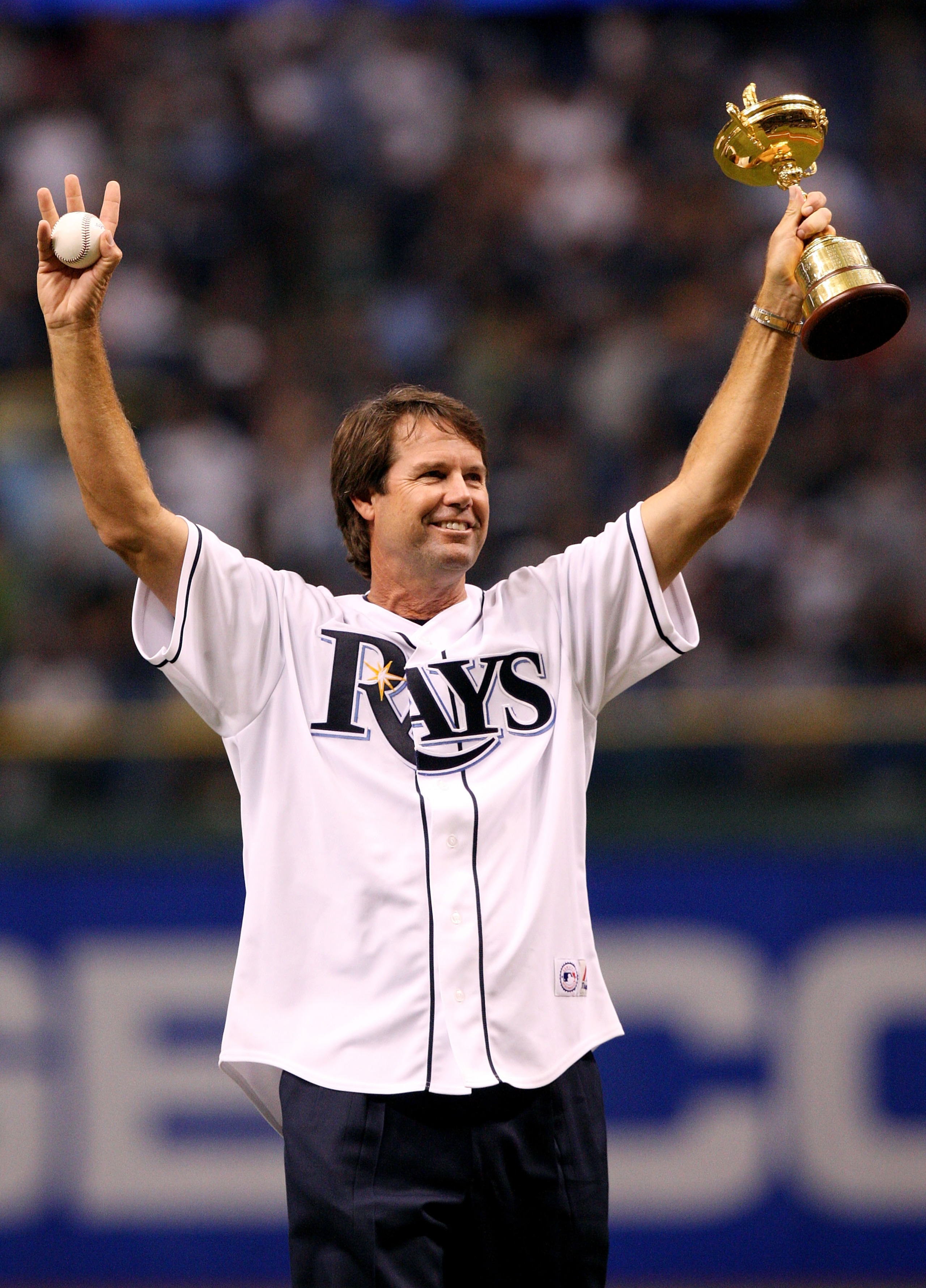 ST PETERSBURG, FL - OCTOBER 03:  Ryder Cup captain Paul Azinger holds up the Ryder Cup trophy as he prepares to throw out the ceremonial first pitch before the Chicago White Sox take on the Tampa Bay Rays in Game 2 of the American Leaugue Divisional Serie