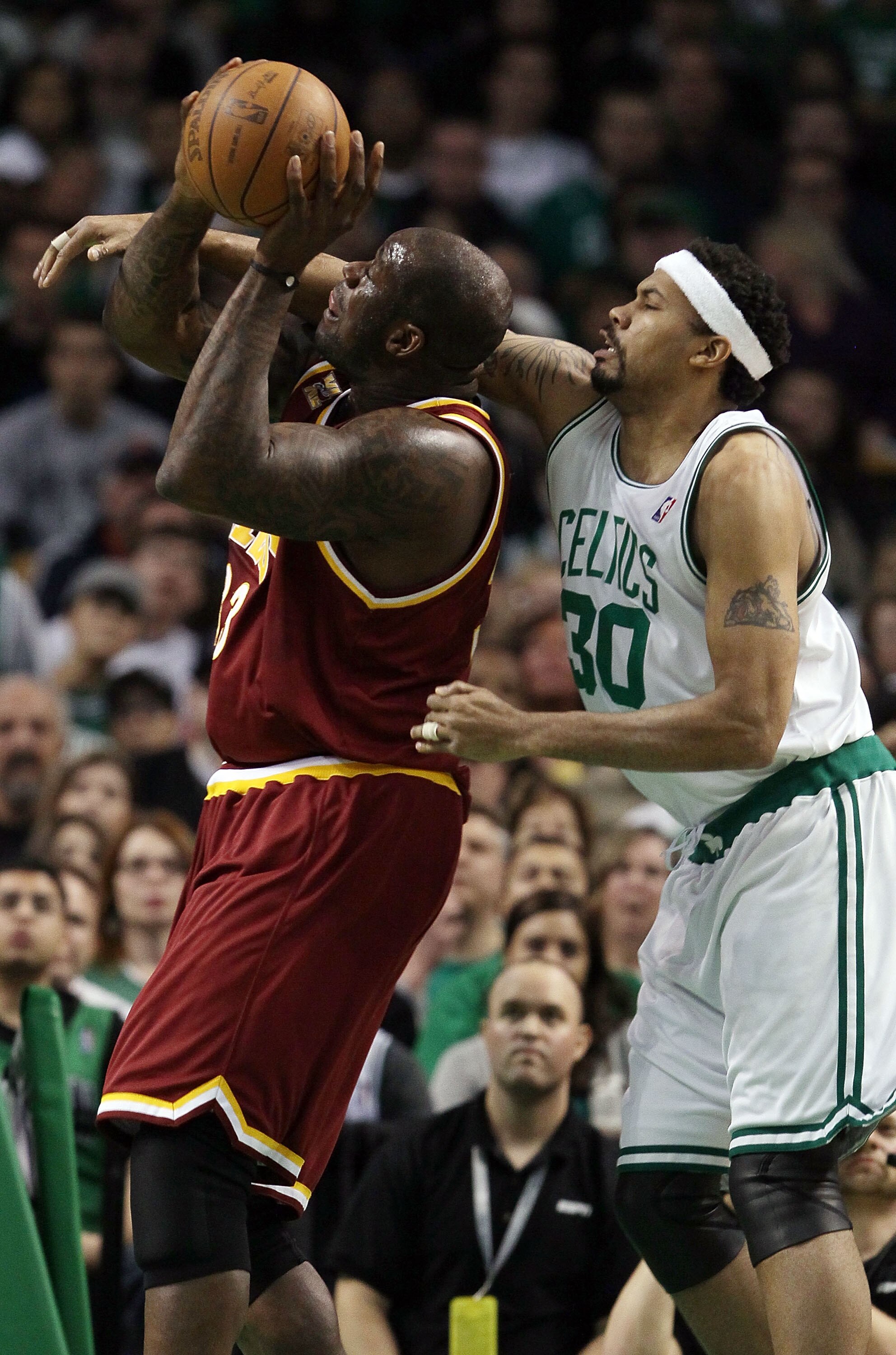 BOSTON - MAY 09:  Shaquille O'Neal #33 of the Cleveland Cavaliers is fouled by Rasheed Wallace #30 of the Boston Celtics during Game Four of the Eastern Conference Semifinals of the 2010 NBA playoffs at TD Garden on May 9, 2010 in Boston, Massachusetts  N