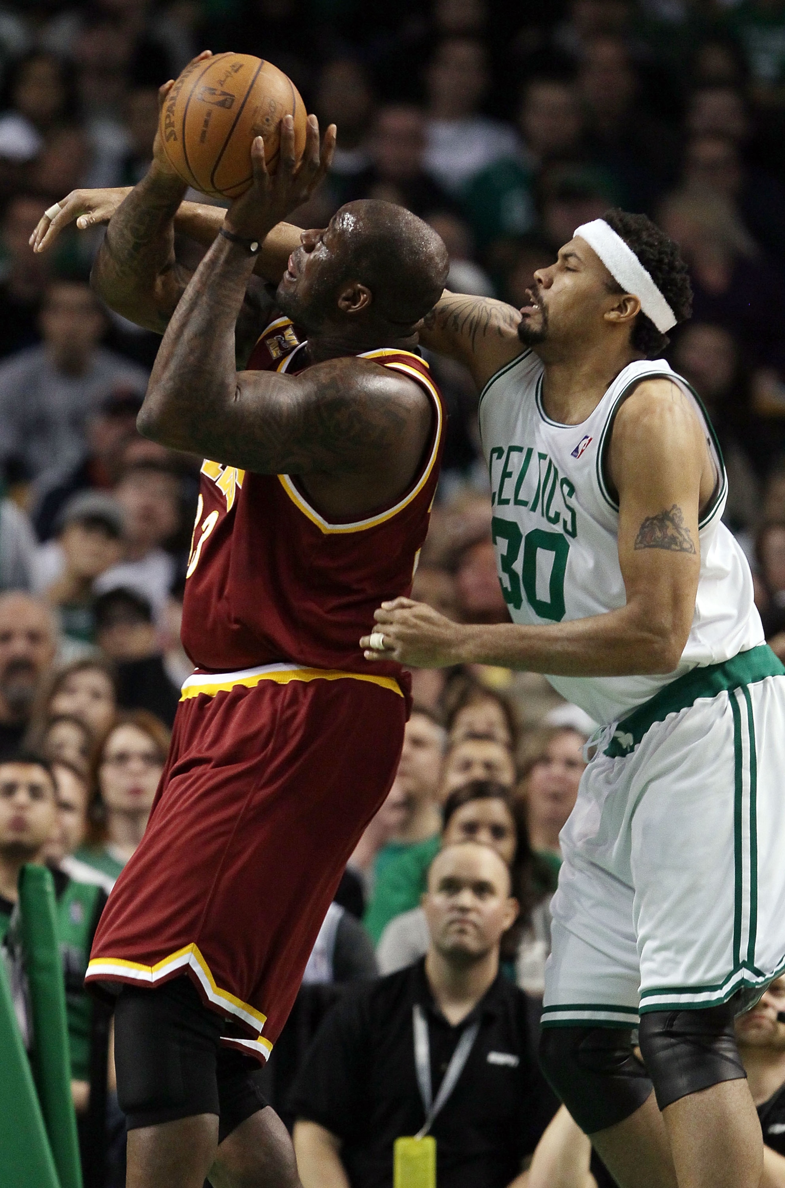 BOSTON - MAY 09:  Shaquille O'Neal #33 of the Cleveland Cavaliers is fouled by Rasheed Wallace #30 of the Boston Celtics during Game Four of the Eastern Conference Semifinals of the 2010 NBA playoffs at TD Garden on May 9, 2010 in Boston, Massachusetts  N