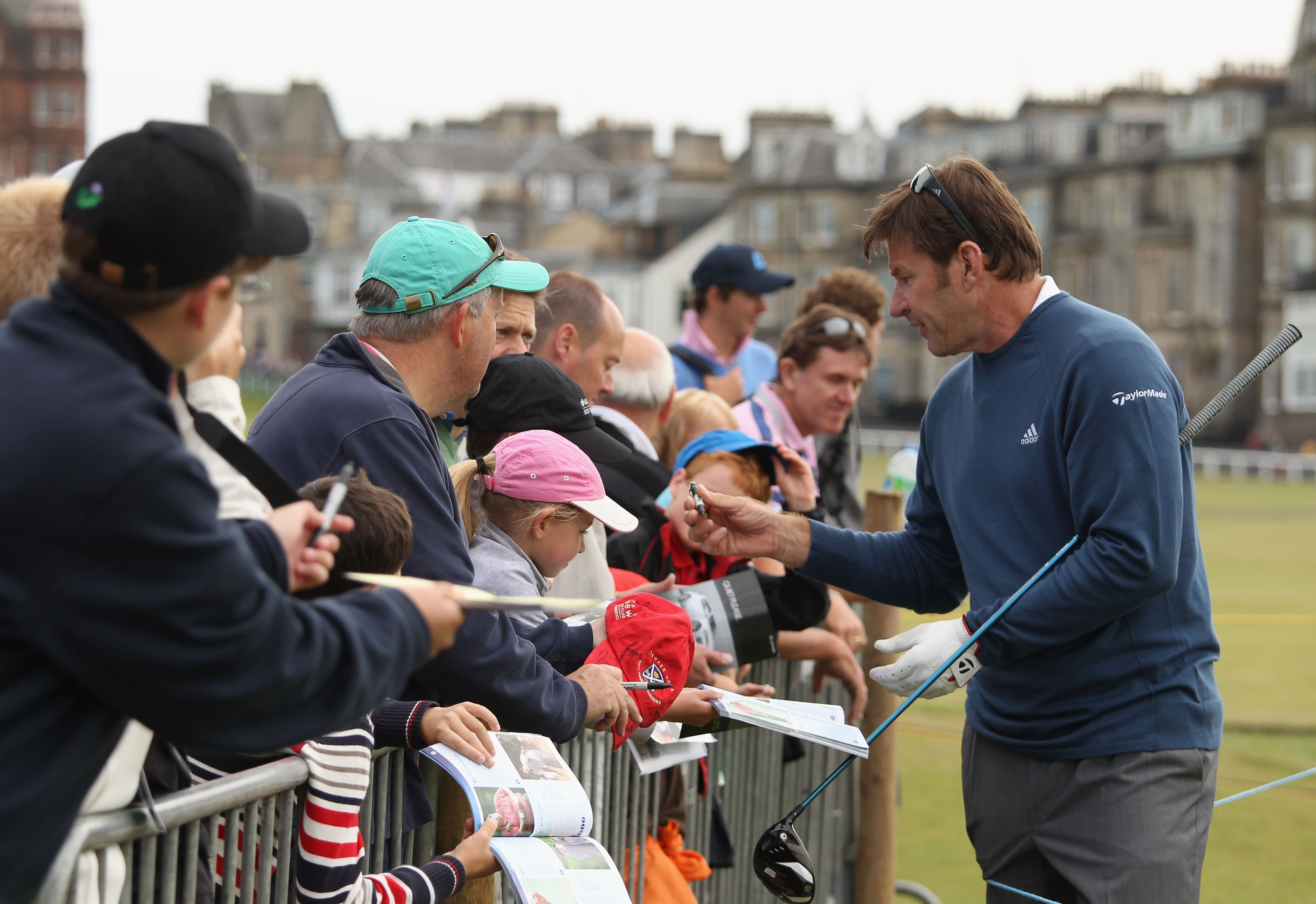 ST ANDREWS, SCOTLAND - JULY 12:  Sir Nick Faldo of England signing autographs during practice for the 139th Open Championship on the Old Course, St Andrews on July 12, 2010 in St Andrews, Scotland.  (Photo by Ross Kinnaird/Getty Images)